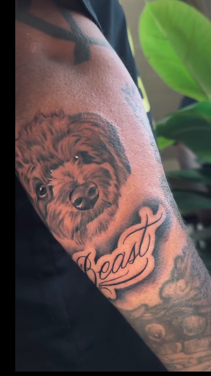 Dog portrait with name realism tattoo on the forearm by Monica Gonzalez