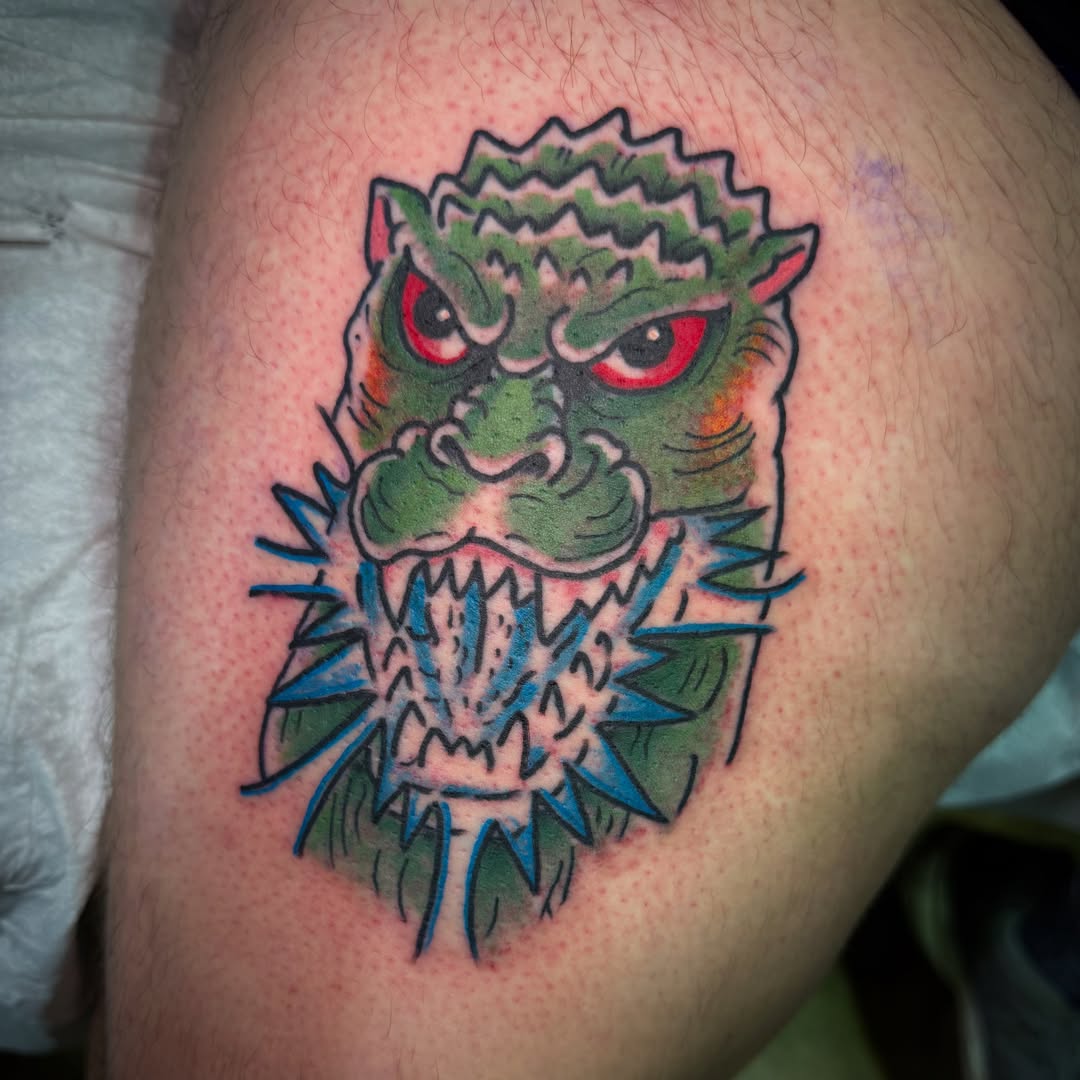 Monster head American traditional tattoo on the thigh by Arron Albaugh