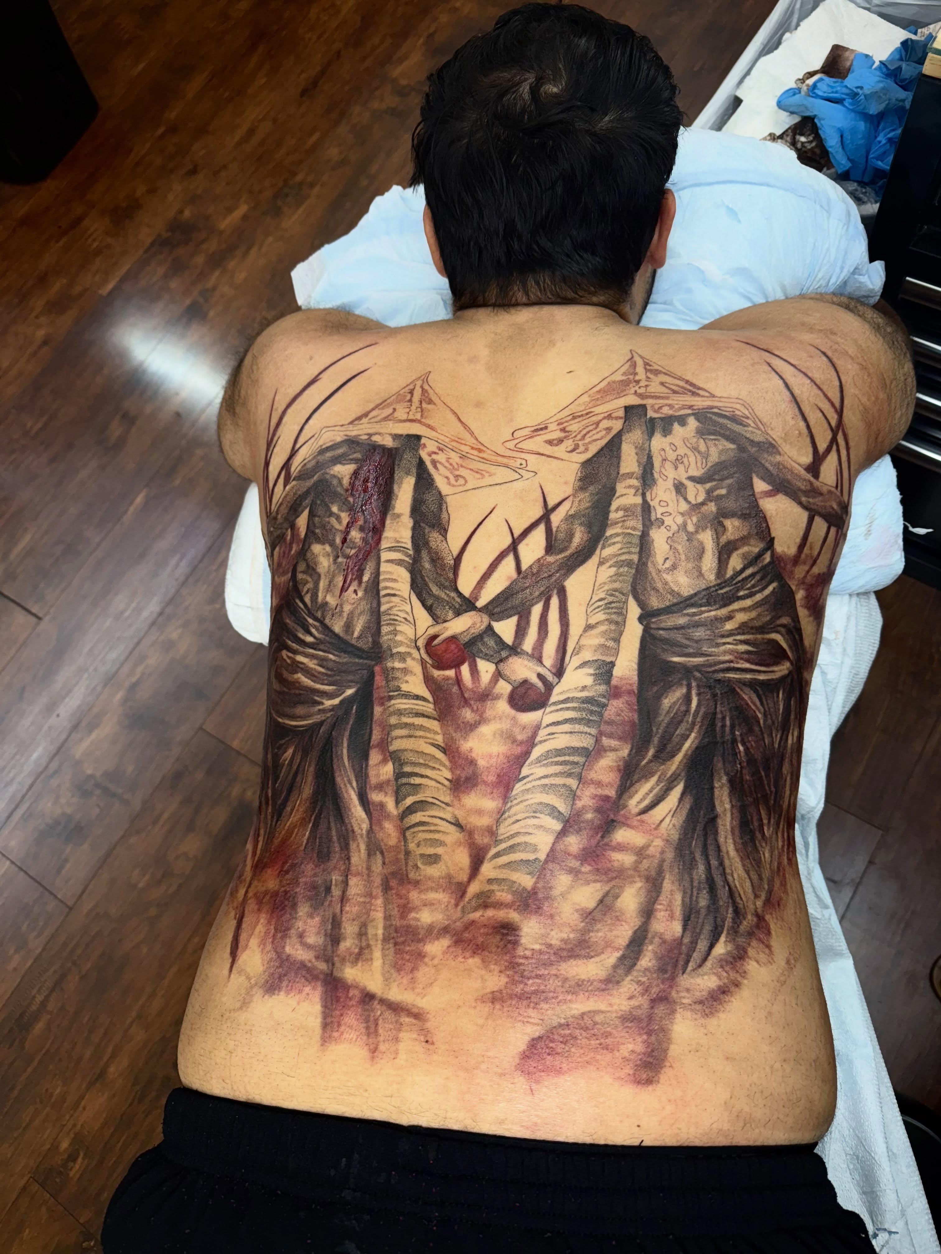 Religious figures realism tattoo on the back by Isabella π€
