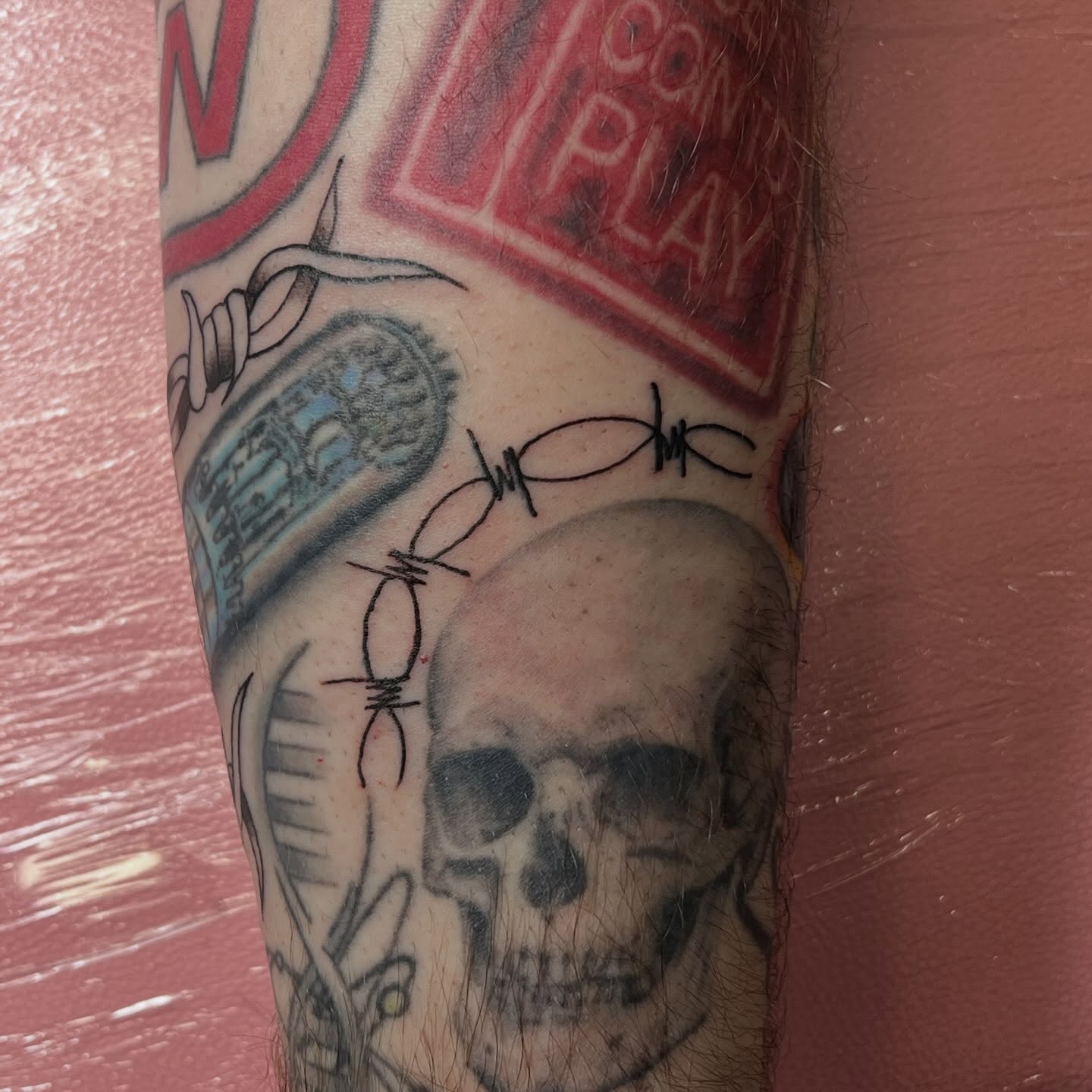 Skull black and grey tattoo on the forearm by Tomfoolery