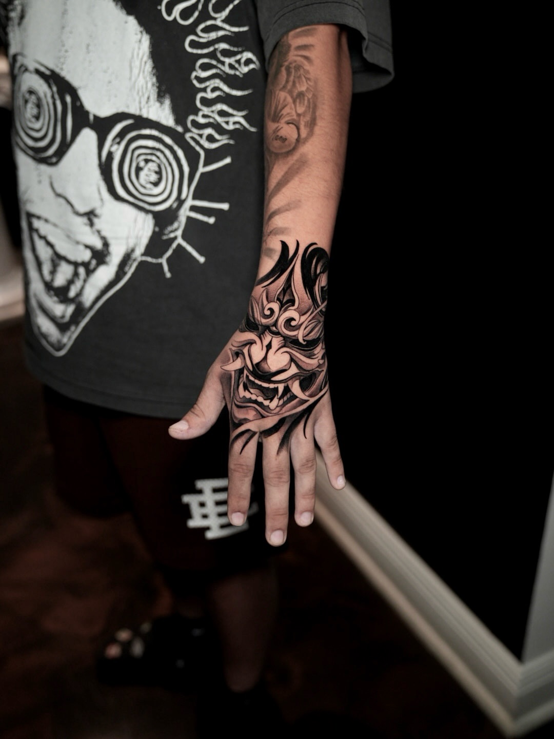 Mask tribal tattoo on the hand by CRISTIAN AMORES シ