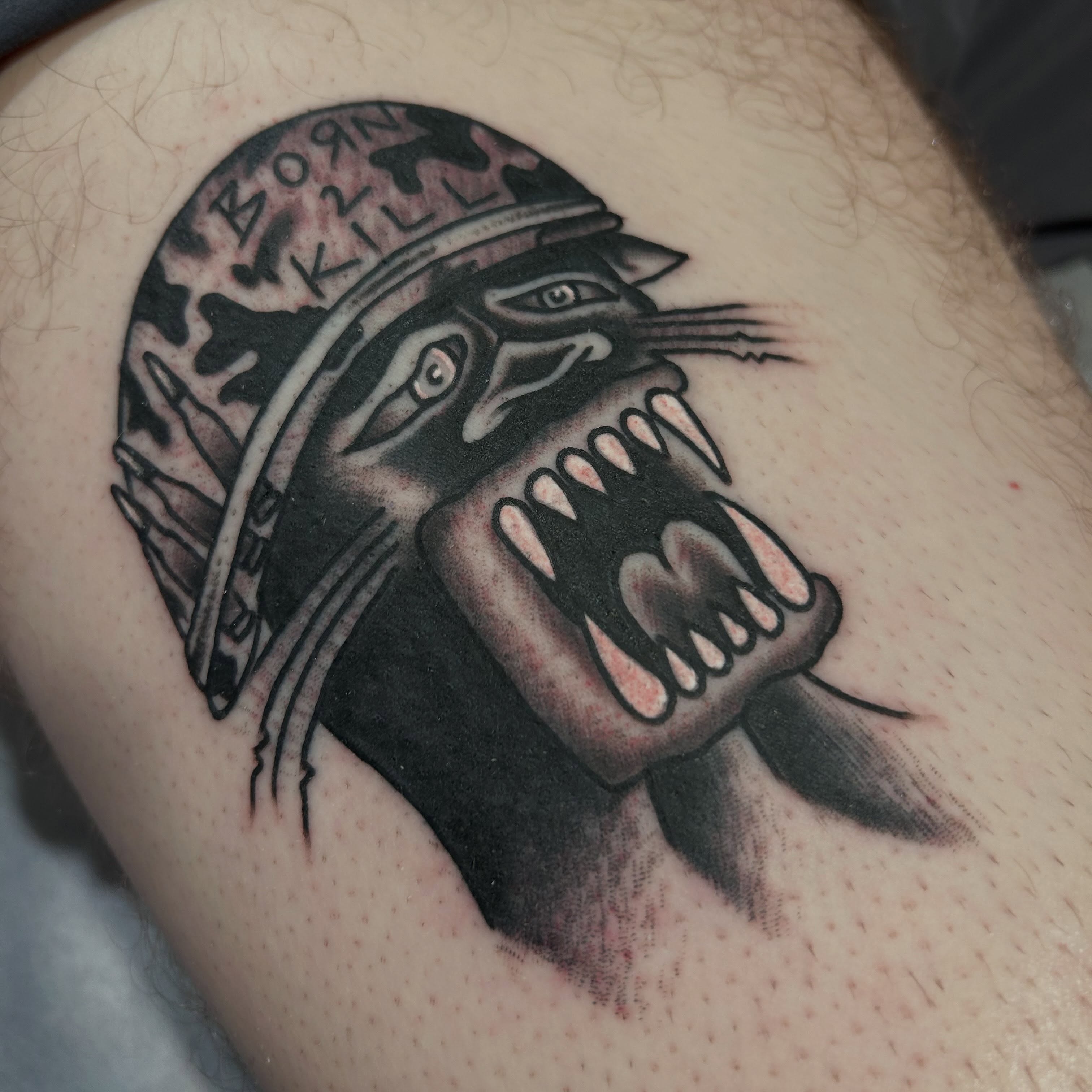 Wolf American traditional tattoo on the thigh by Alex Lang
