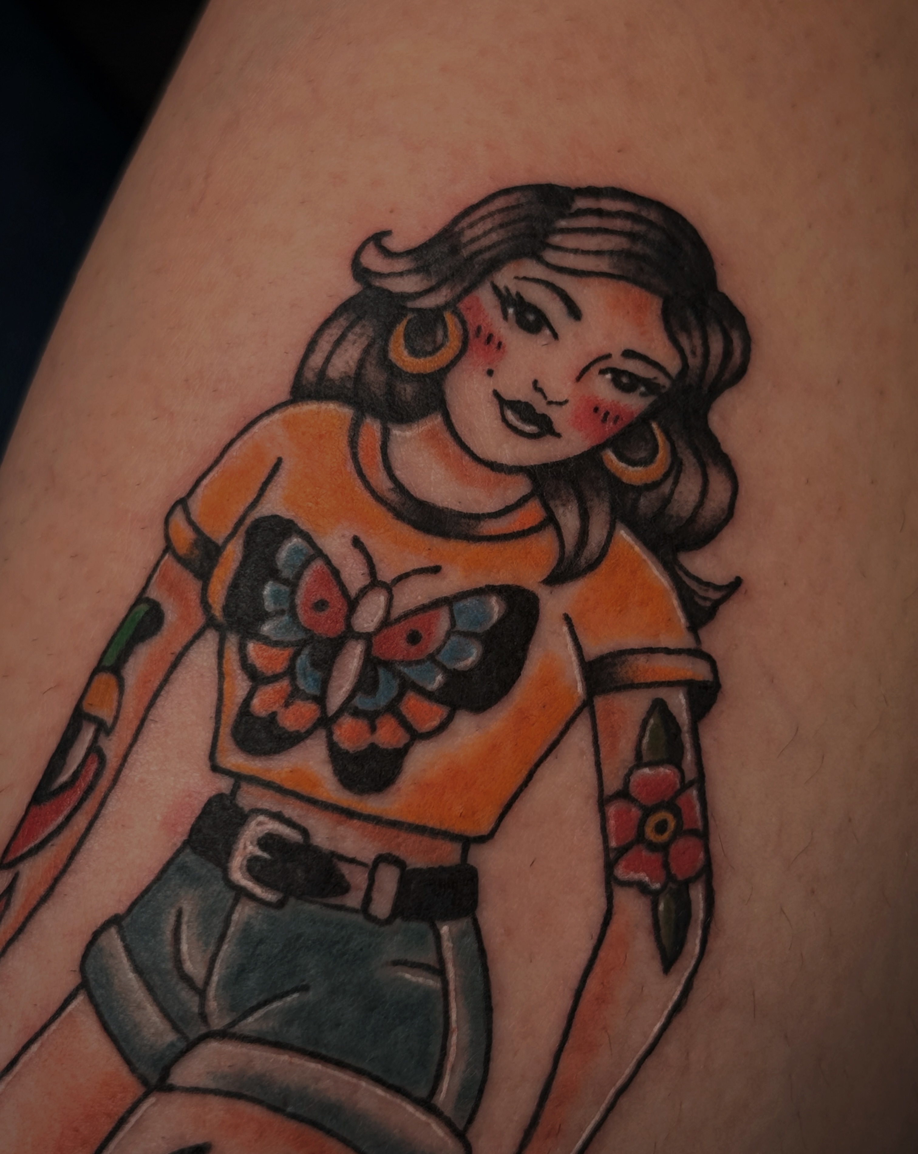 Woman with butterfly American traditional tattoo on the thigh by Kaylee Castleton, Tooele, Utah