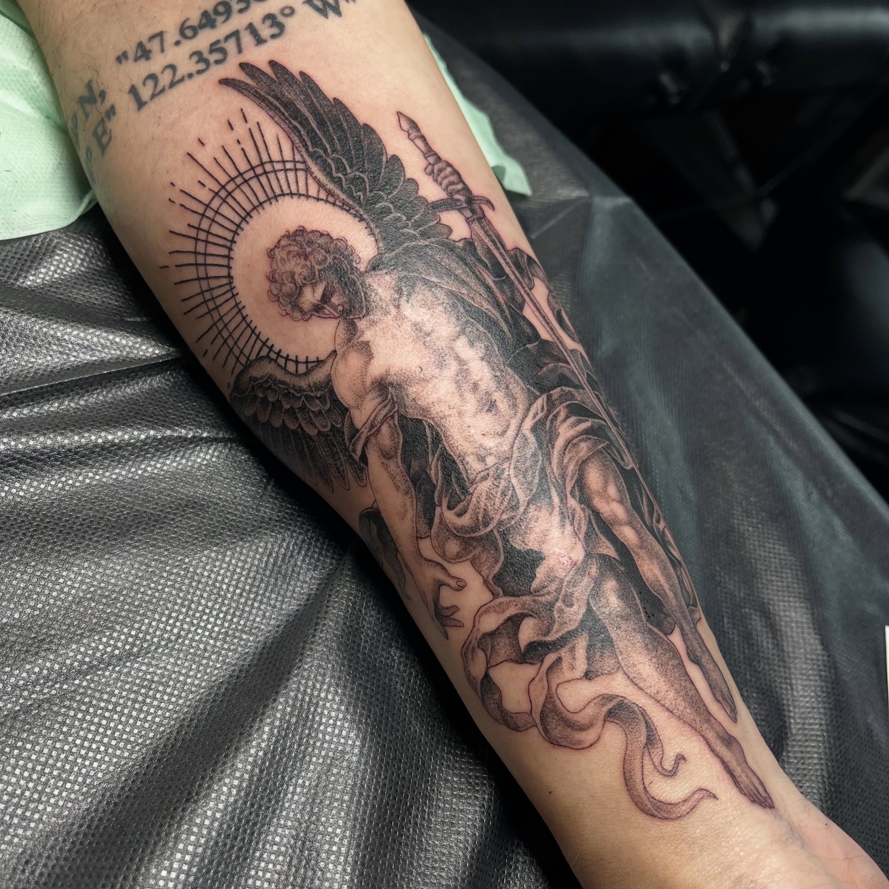 Angel with sword realism tattoo on the forearm by christina diaz