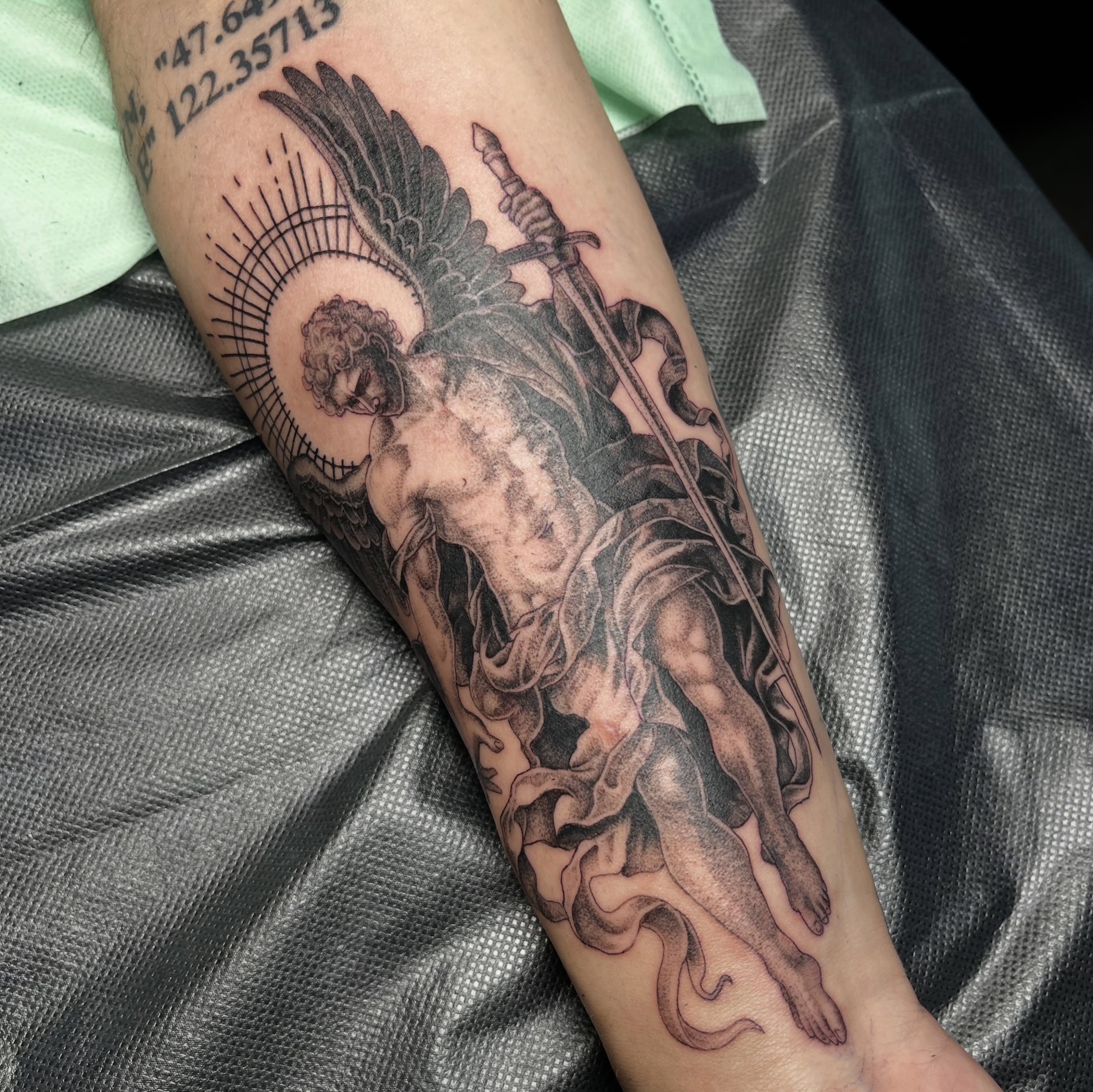 Angel with sword realism tattoo on the forearm by christina diaz