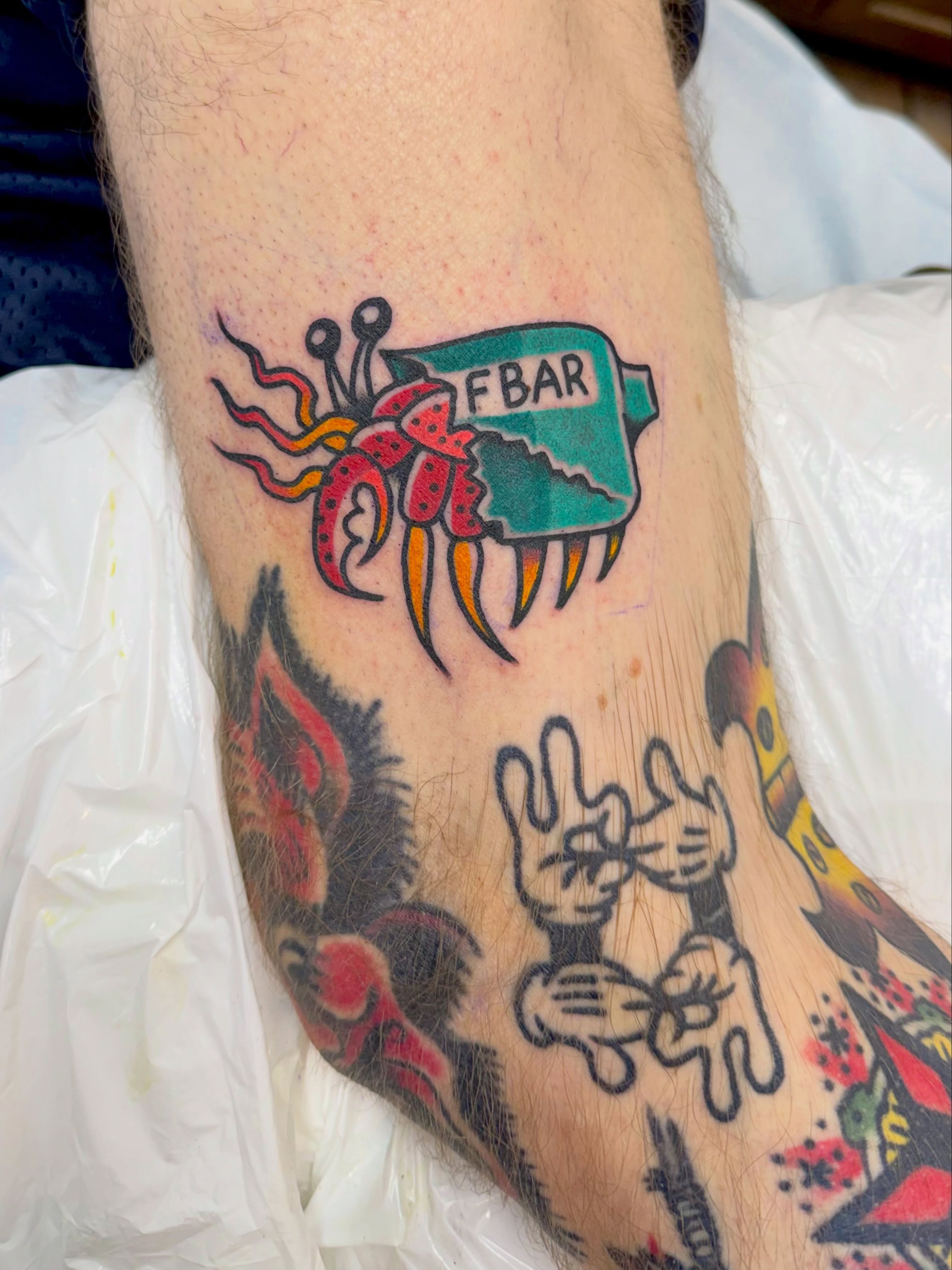 Octopus with banner American traditional tattoo on the forearm by Matt Paw