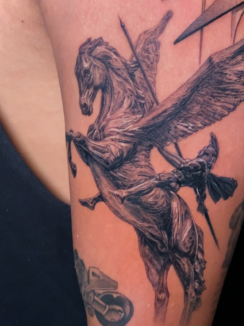 Pegasus and rider realism tattoo on the thigh by Dan Sprague