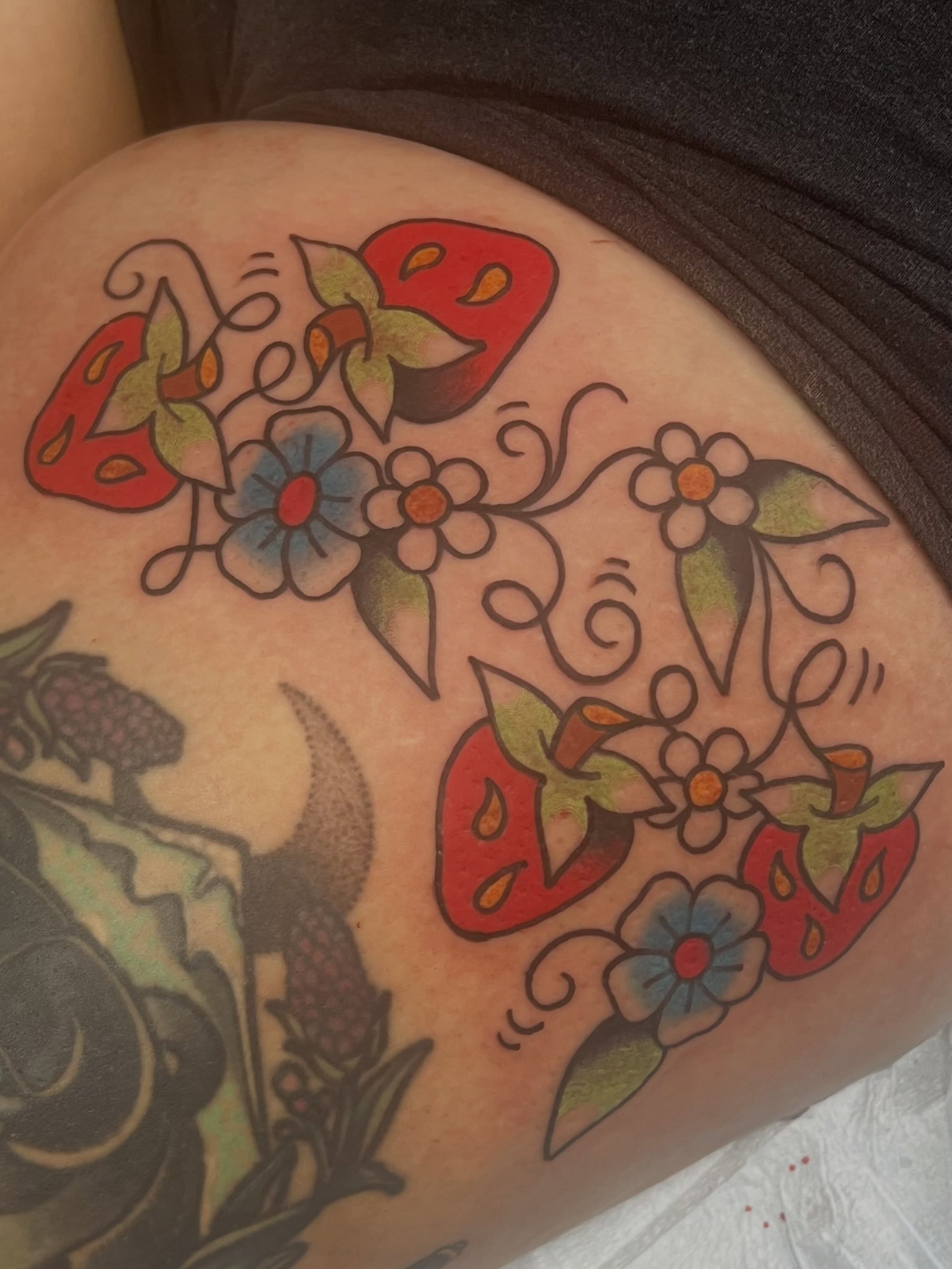 Strawberries and flowers American traditional tattoo on the thigh by ＊jaela＊ohio tattoo artist＊
