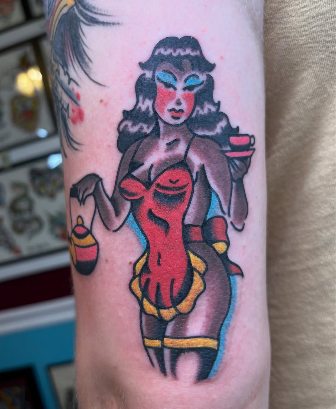 Woman with red dress American traditional tattoo on the forearm by Jake Herbert, Knoxville, Tennessee