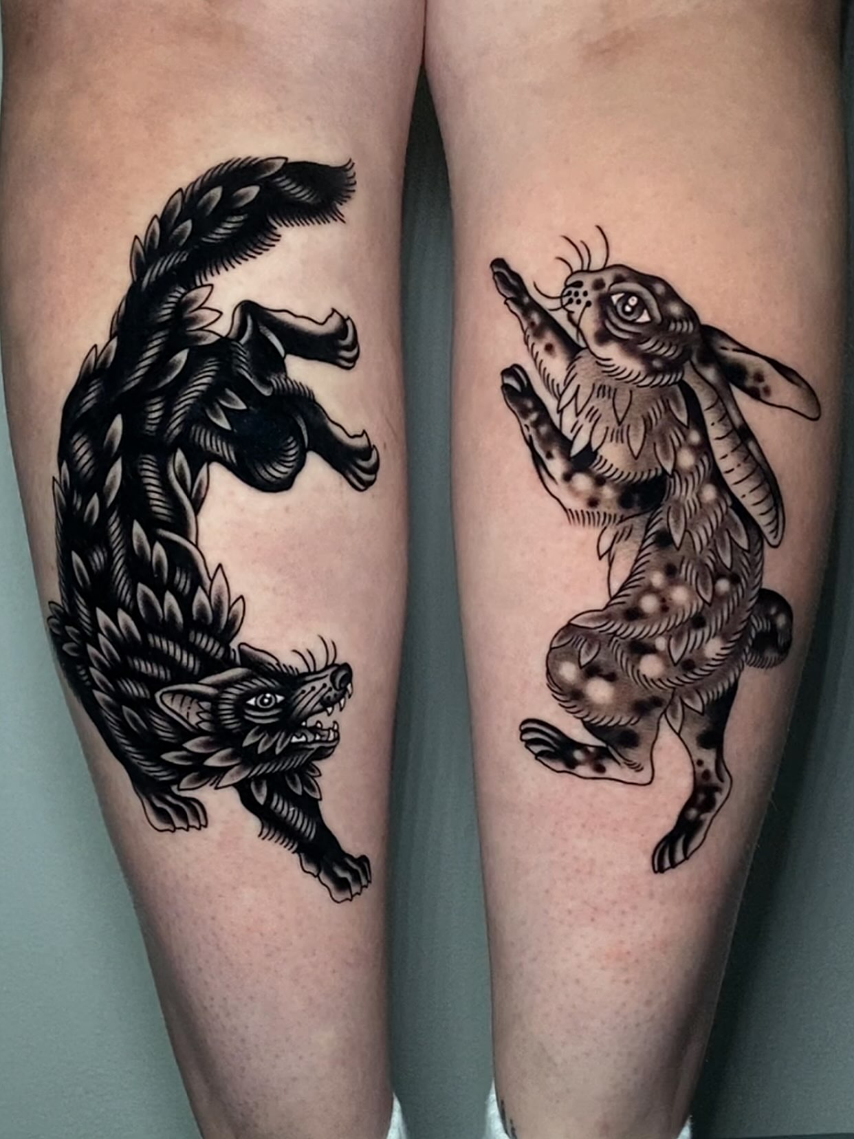Wolf and rabbit black and grey tattoo on the thigh by Justin R. Mitchell, Fort Worth, Texas
