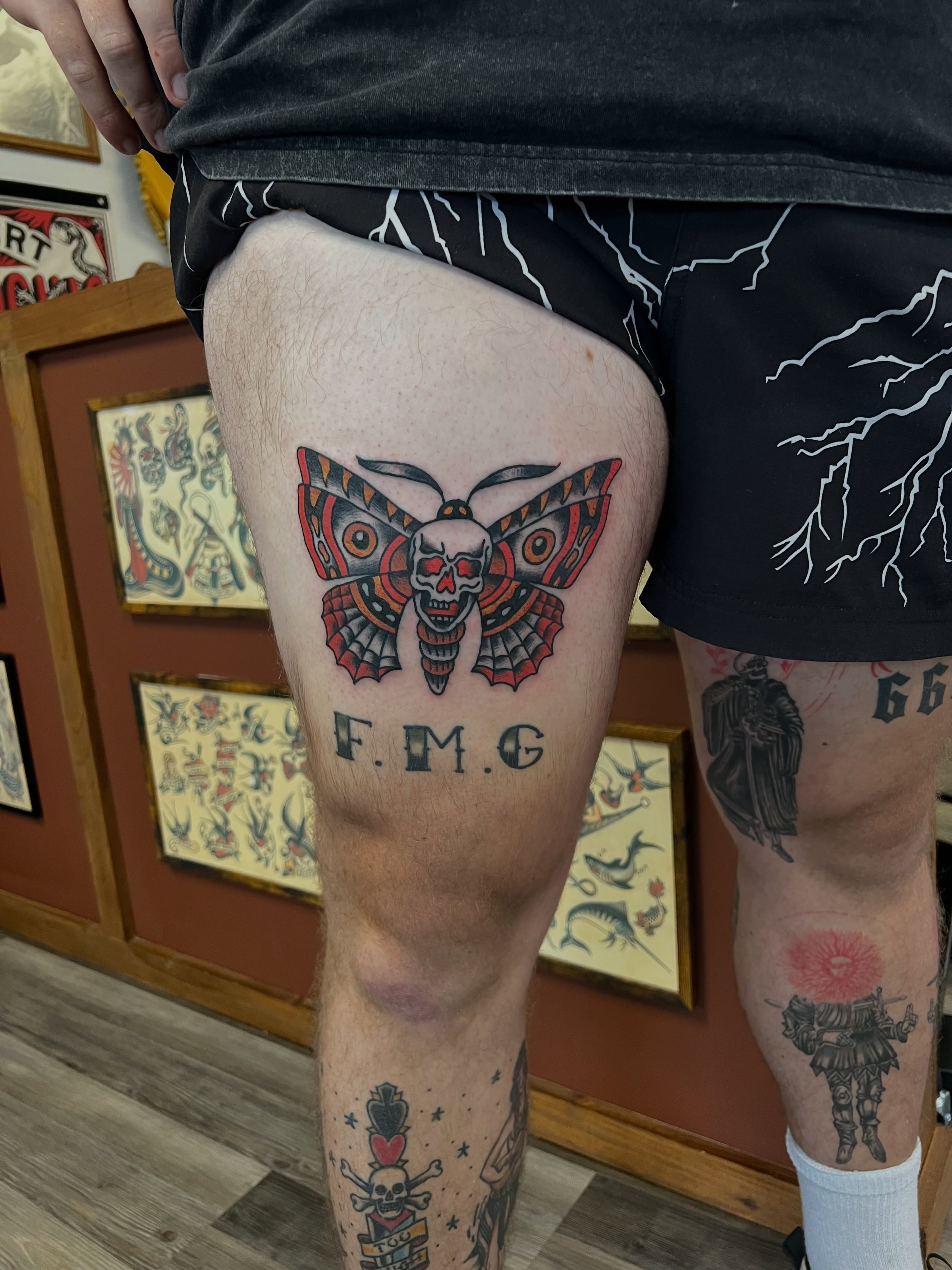 Butterfly skull American traditional tattoo on the thigh by Christopher Durao