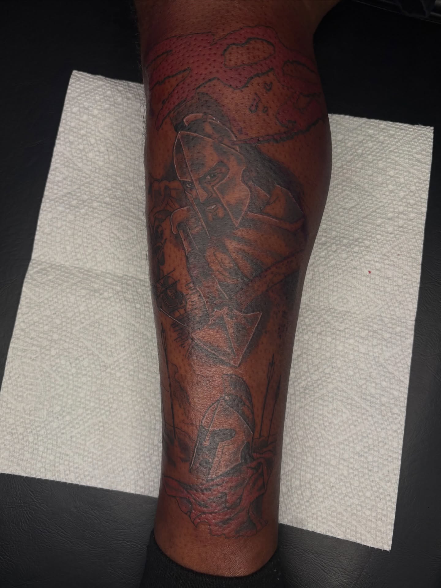 Warrior dotwork tattoo on the calf by Evan Chastain