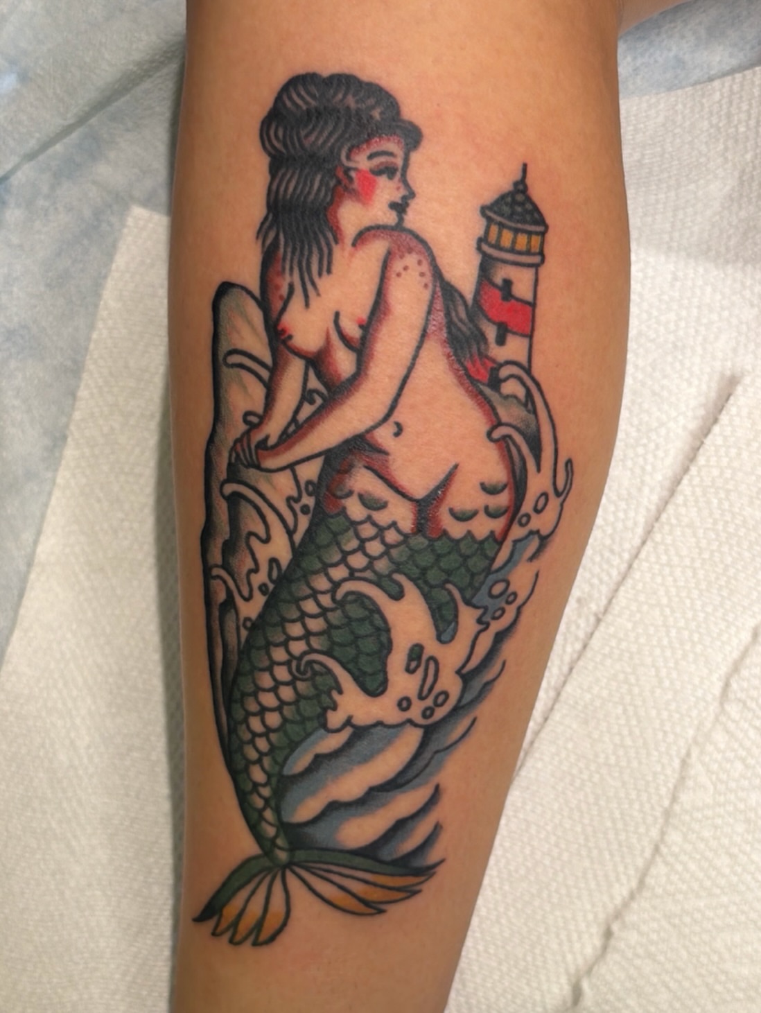 Mermaid American traditional tattoo on the forearm by Emma Fox Tattoo