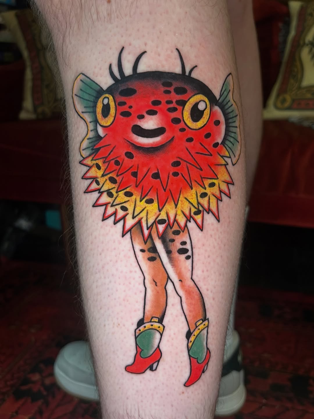 Pufferfish with human legs American traditional tattoo on the leg by Olivia Marie