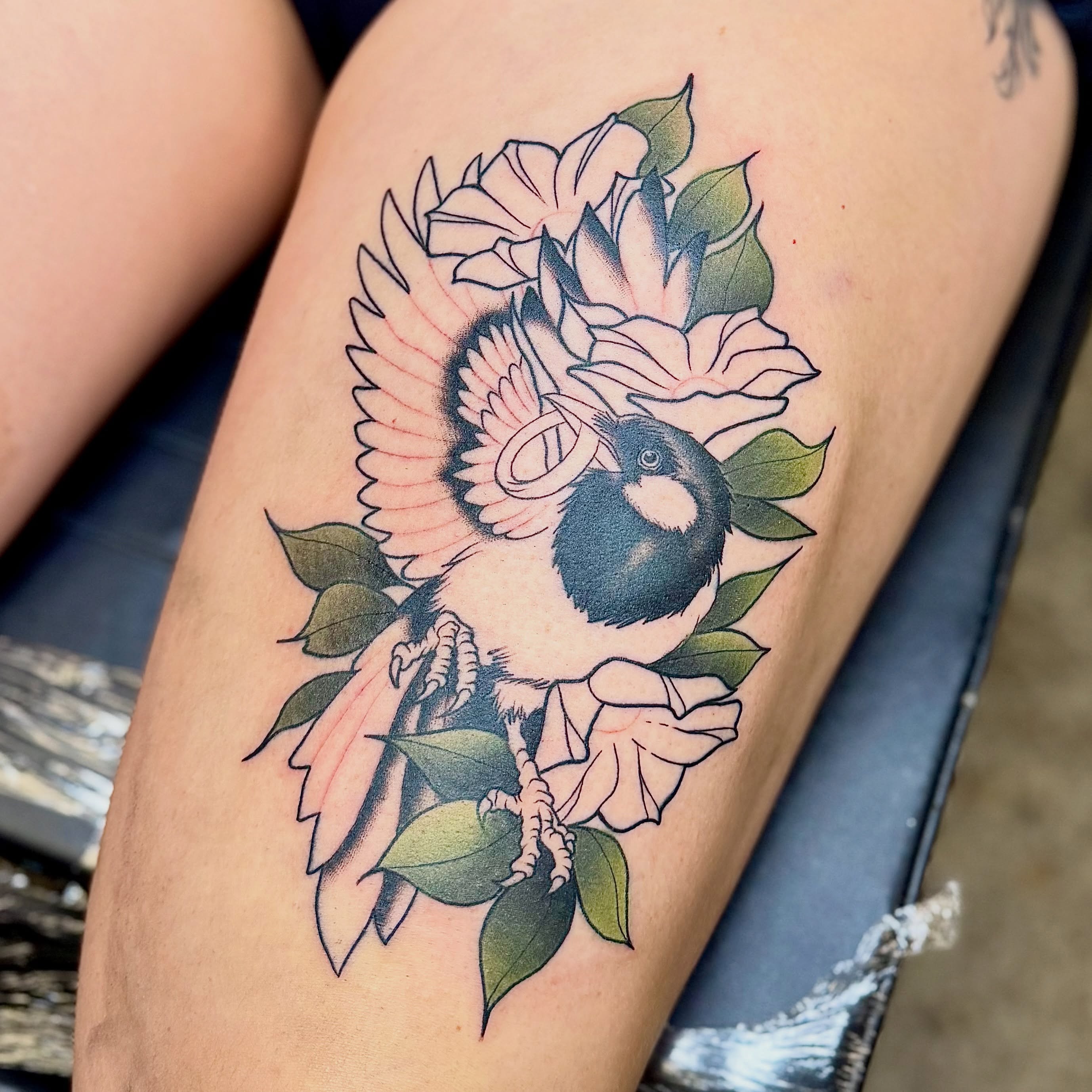 Bird and flowers American traditional tattoo on the thigh by Jamie Hall, Kansas City, Missouri