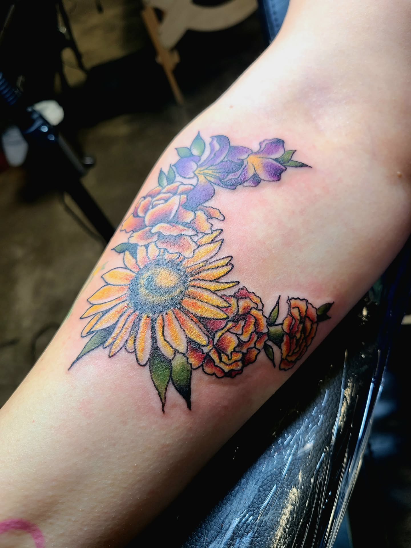 Sunflower and roses American traditional tattoo on the forearm by Meggalodon 🖤 (Meggan Rose)