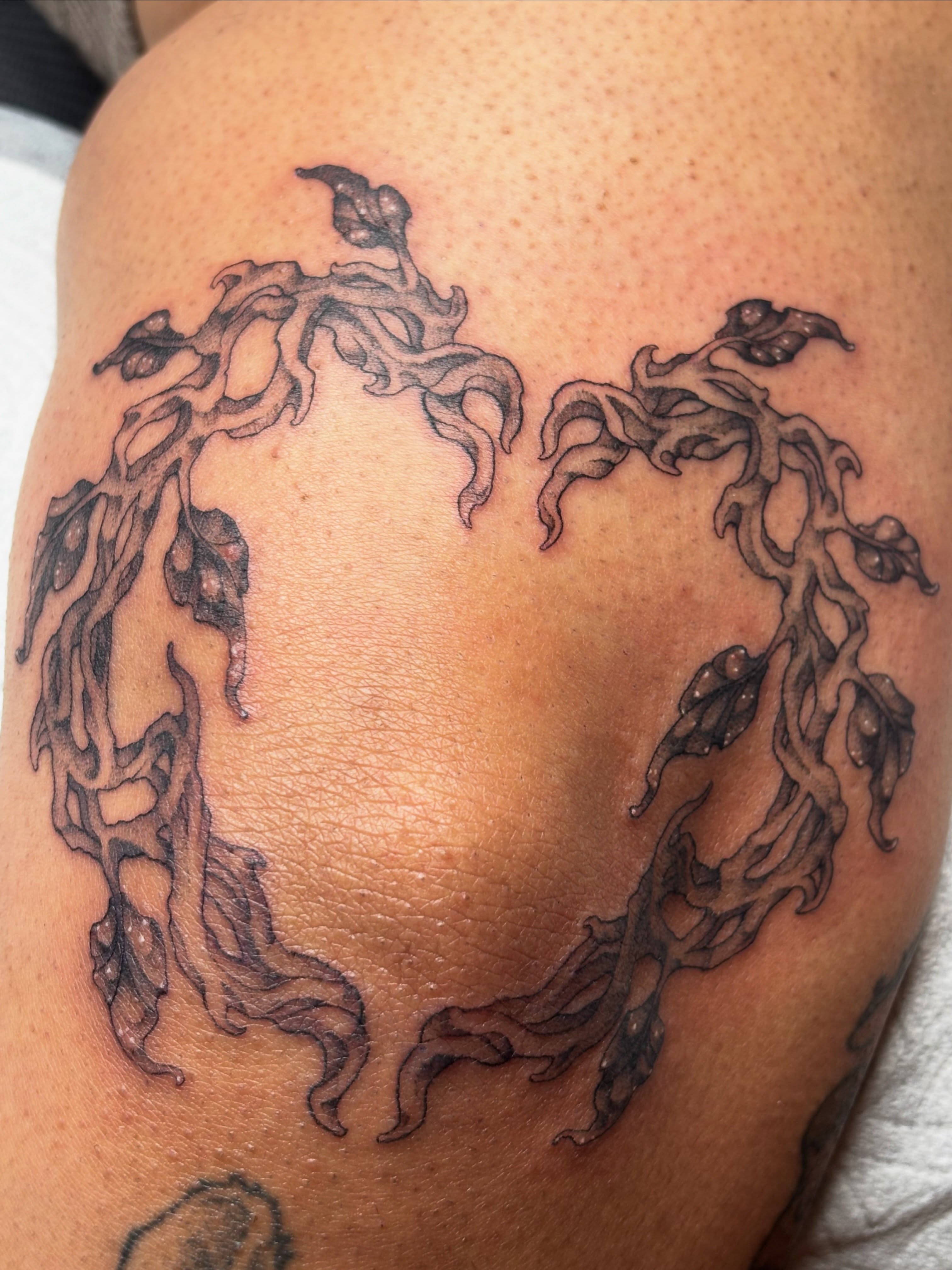 Abstract flame black and grey tattoo on the shoulder by Rachel Foster