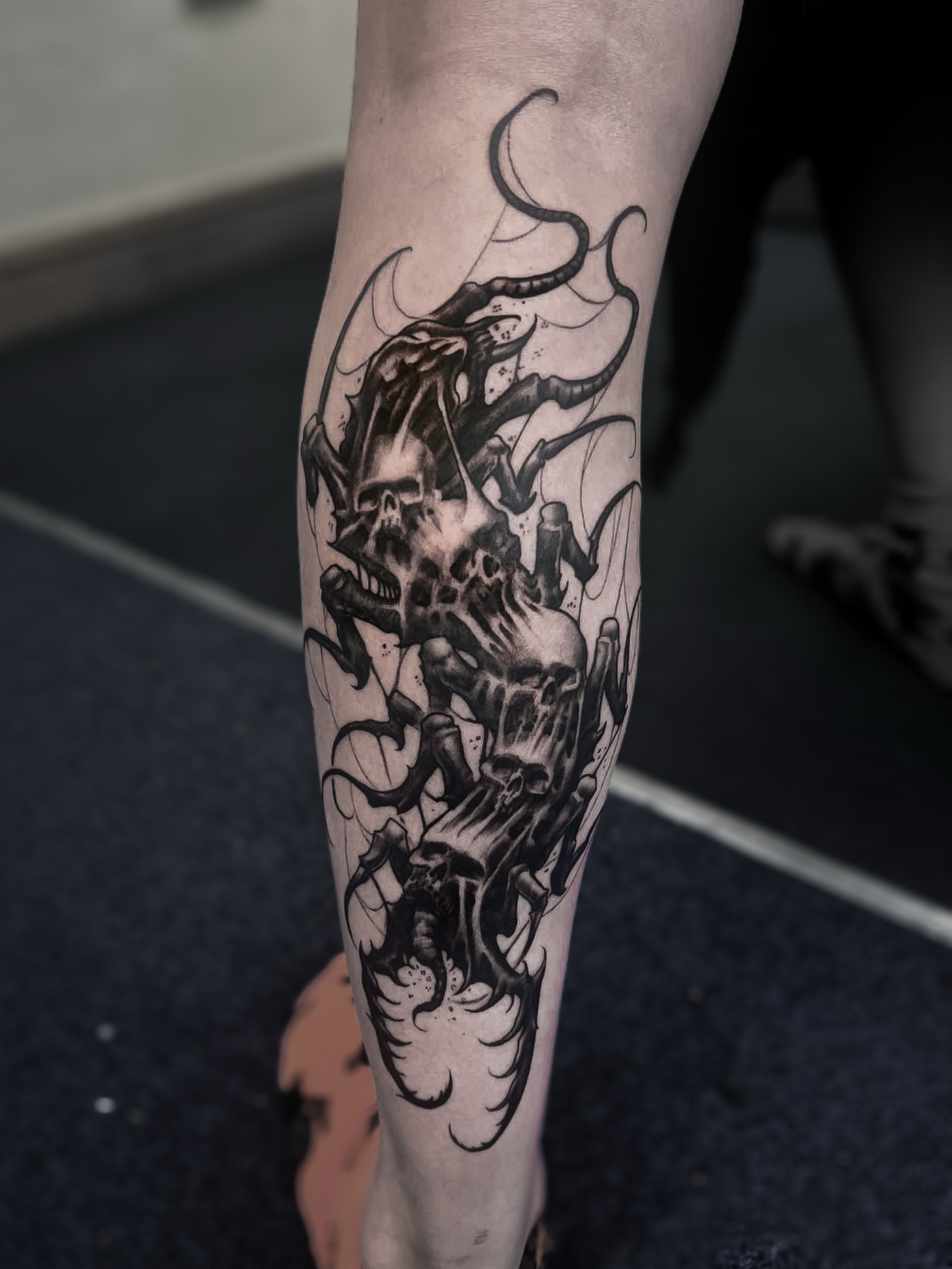 Tattoo by @crawlspace_tattoo — black_and_grey, dark_realism