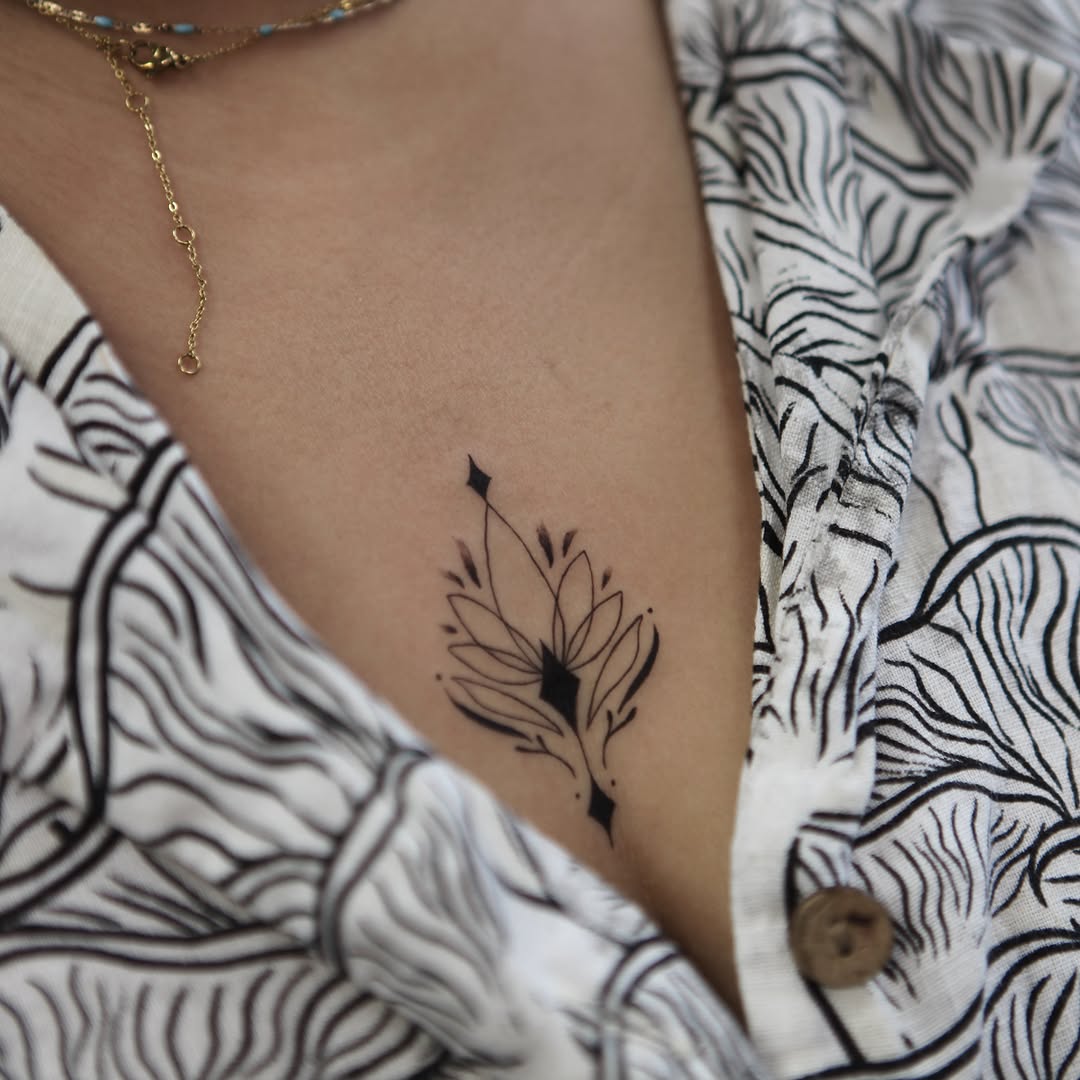 Flower black and grey tattoo on the ribs by Liv