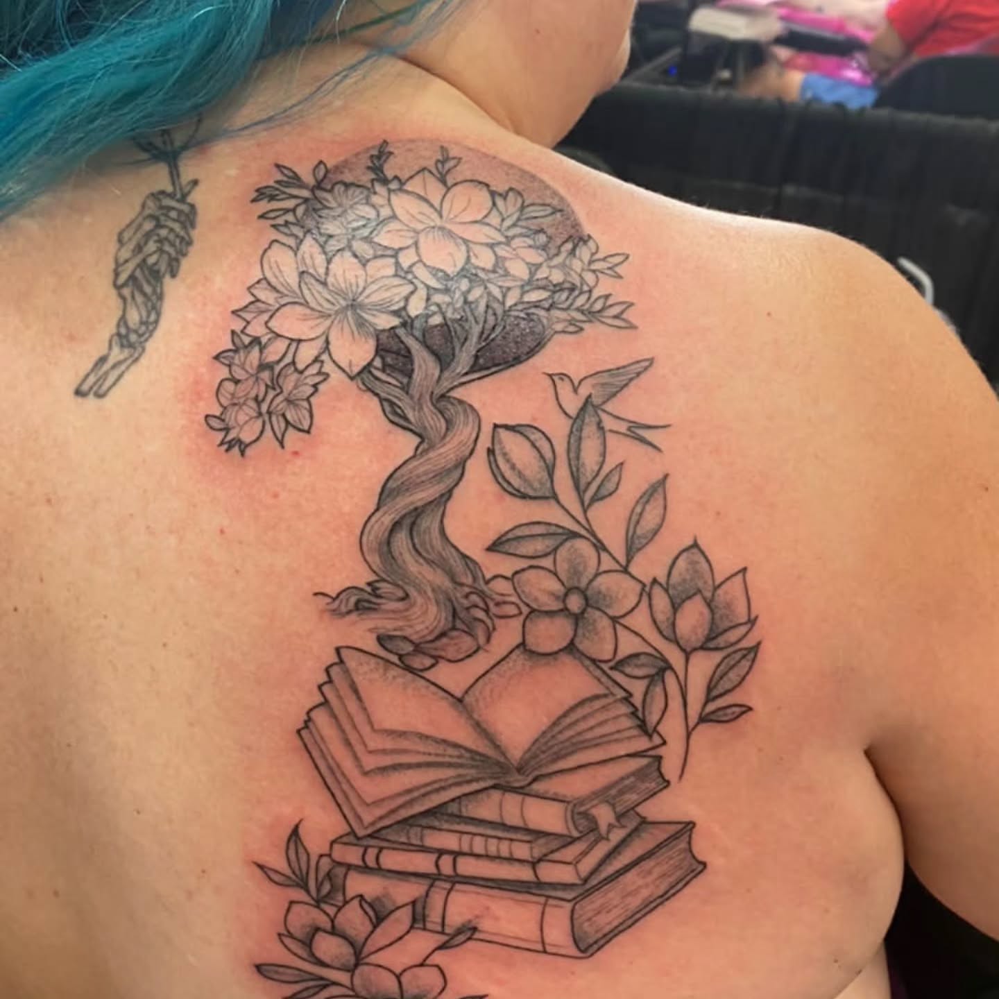 Book and floral tree realism tattoo on the back by BeardedMoney