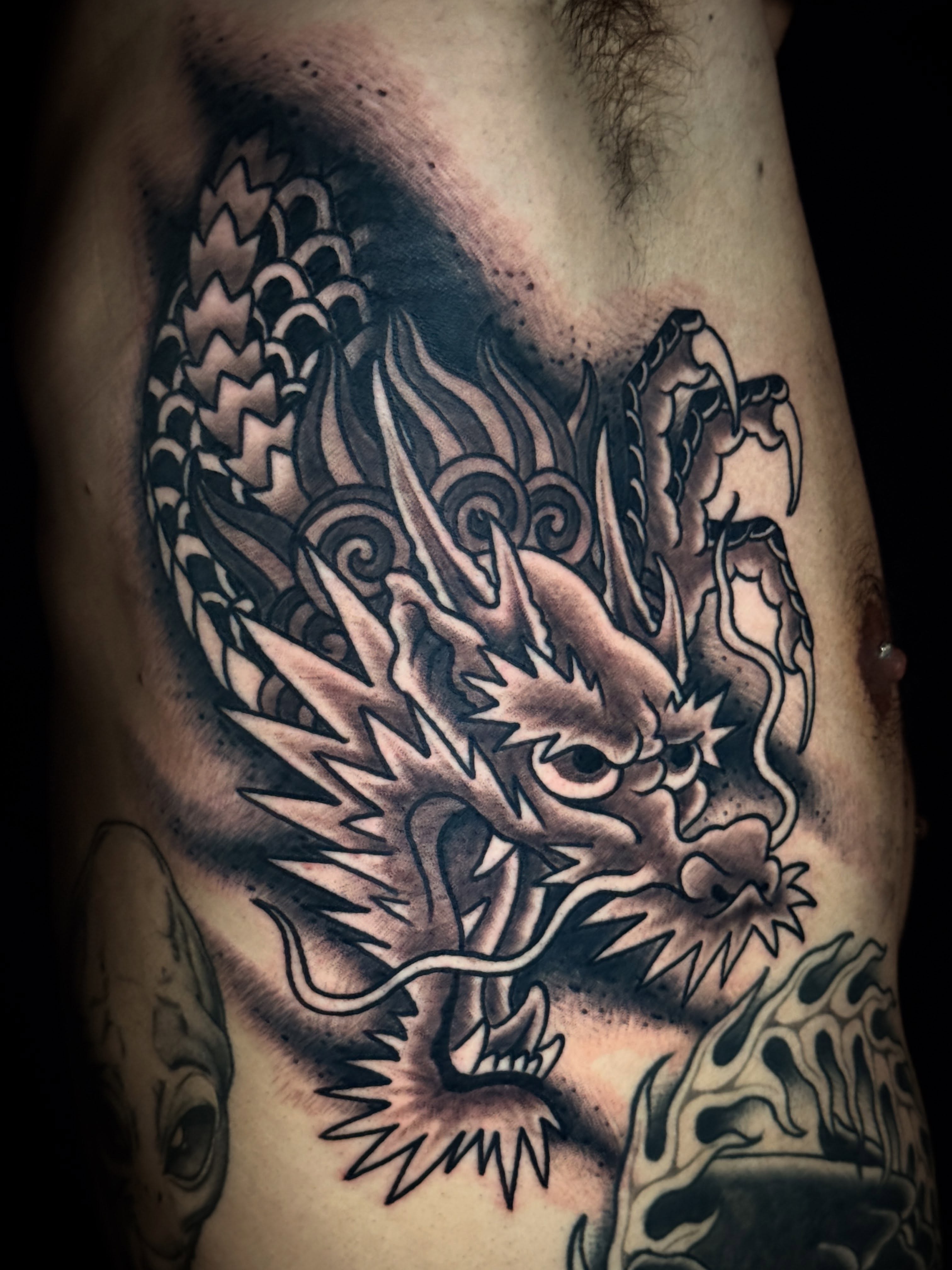 Dragon black and grey tattoo on the ribs by 🕸curtis Fink🕸