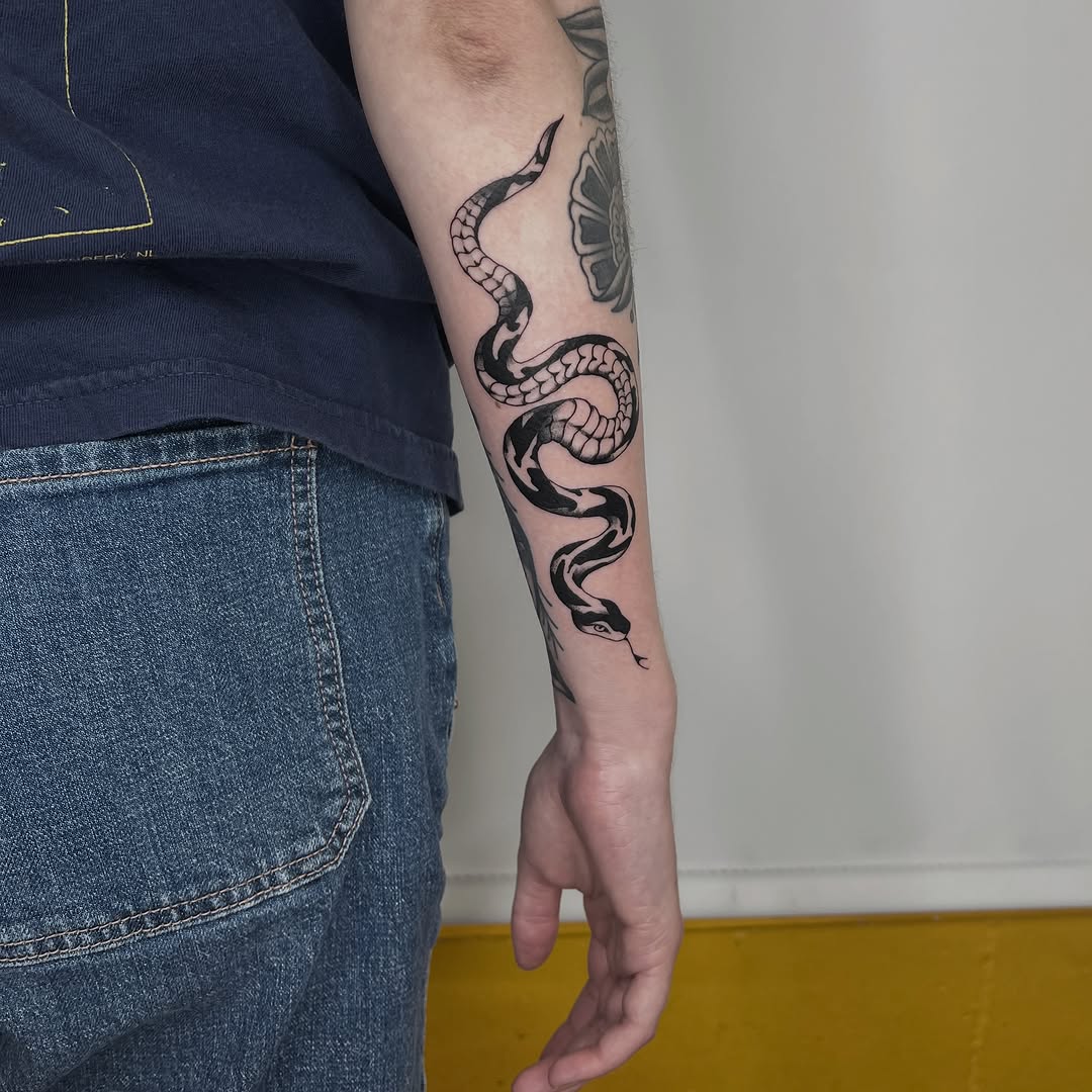 Snake American traditional tattoo on the forearm by Elleree (LRE)