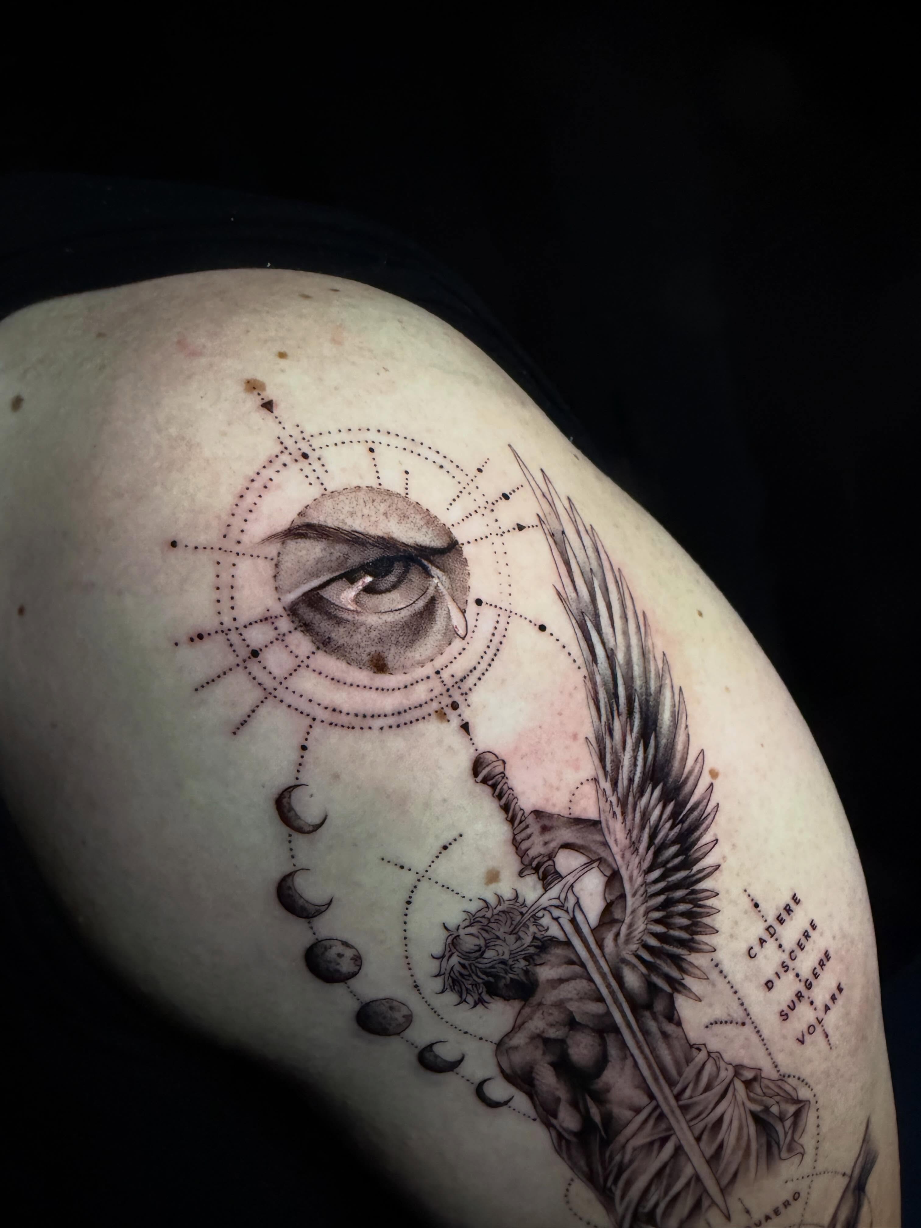 Eye and angel geometric tattoo on the shoulder by Jan Xander