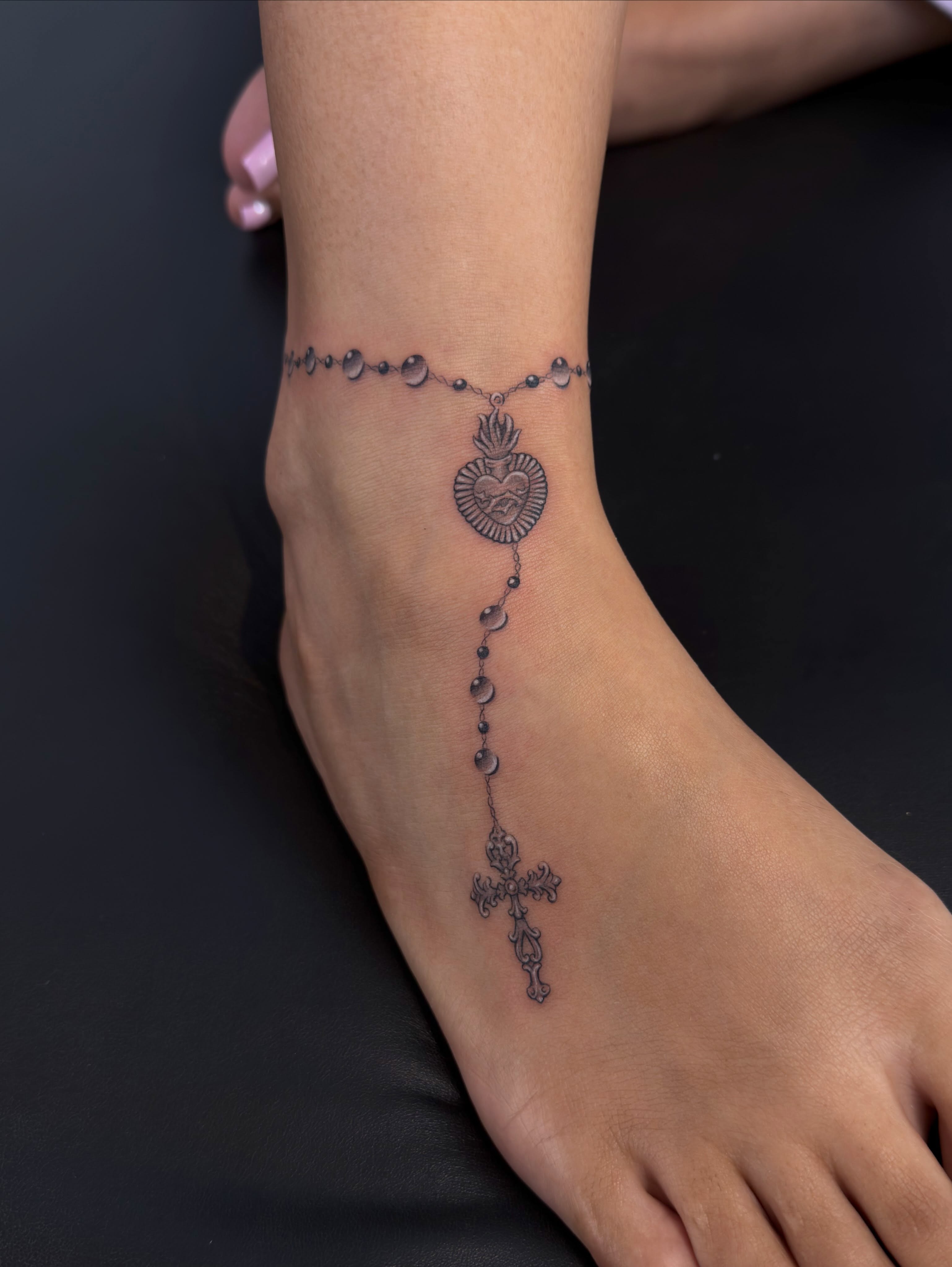 Rosary black and grey tattoo on the foot by Nayoung, San Francisco, California