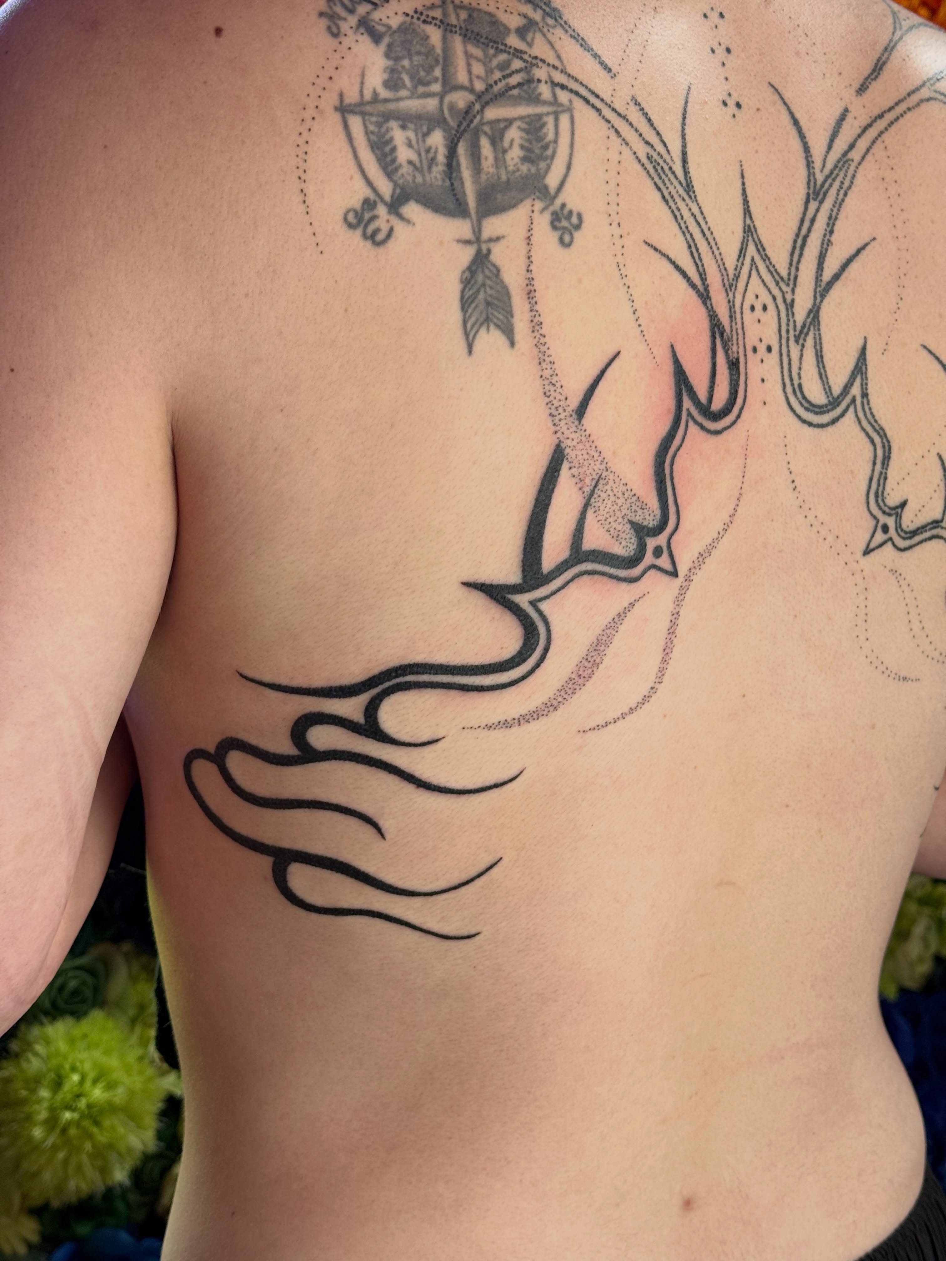 Abstract design dotwork tattoo on the back by Handpoke Tattoo Artist, Minneapolis, Minnesota