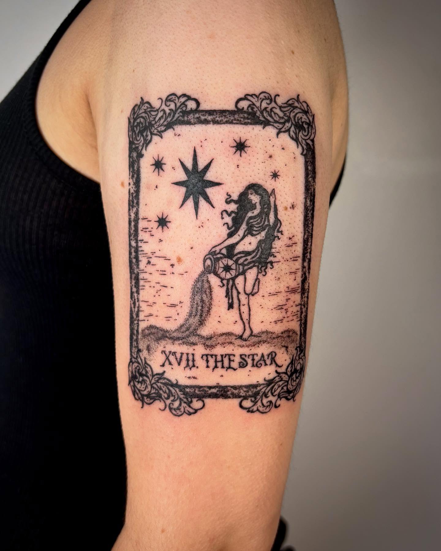 The star tarot card black and grey tattoo on the forearm by kendle
