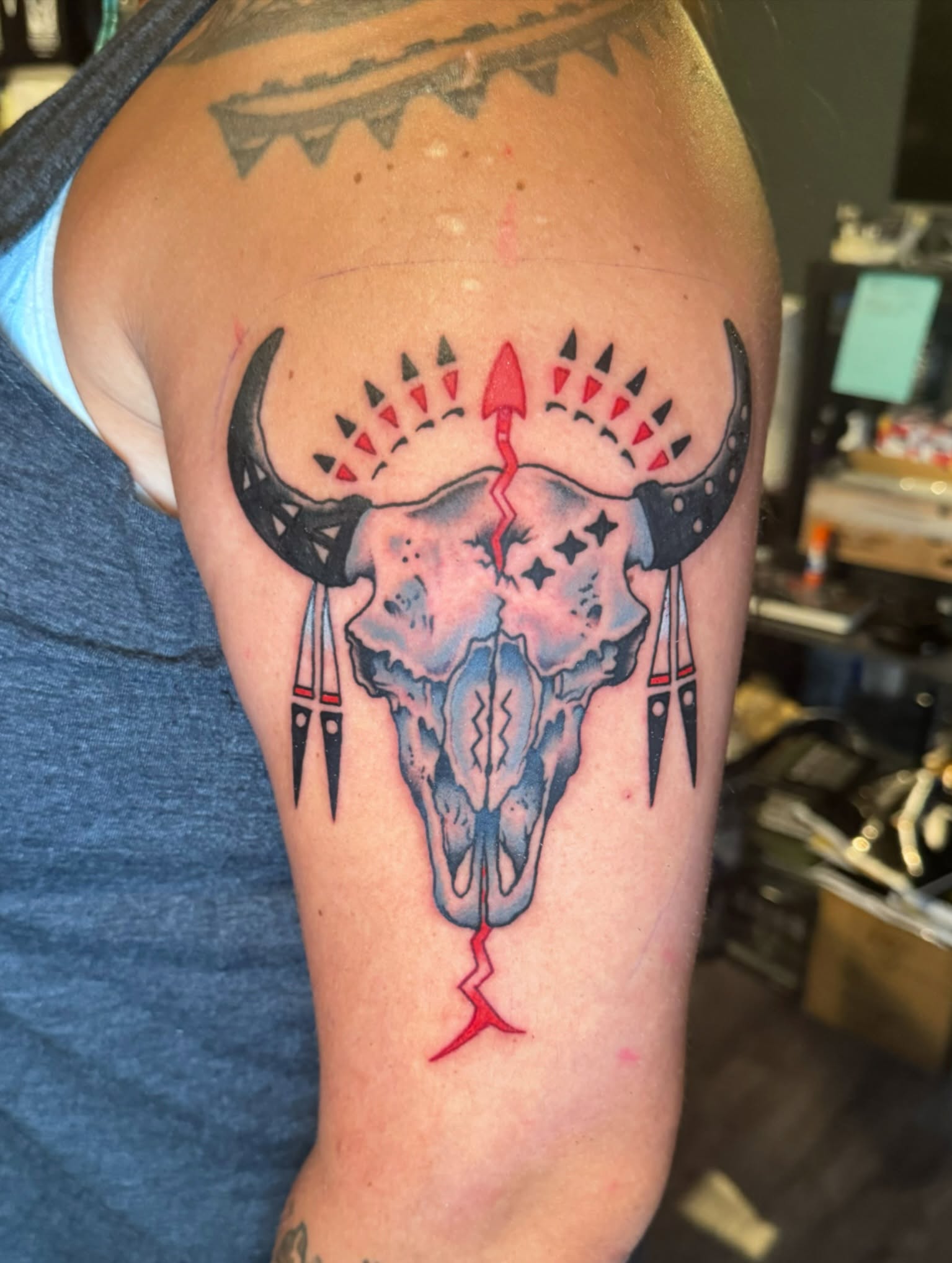 Bull skull American traditional tattoo on the shoulder by Minneapolis