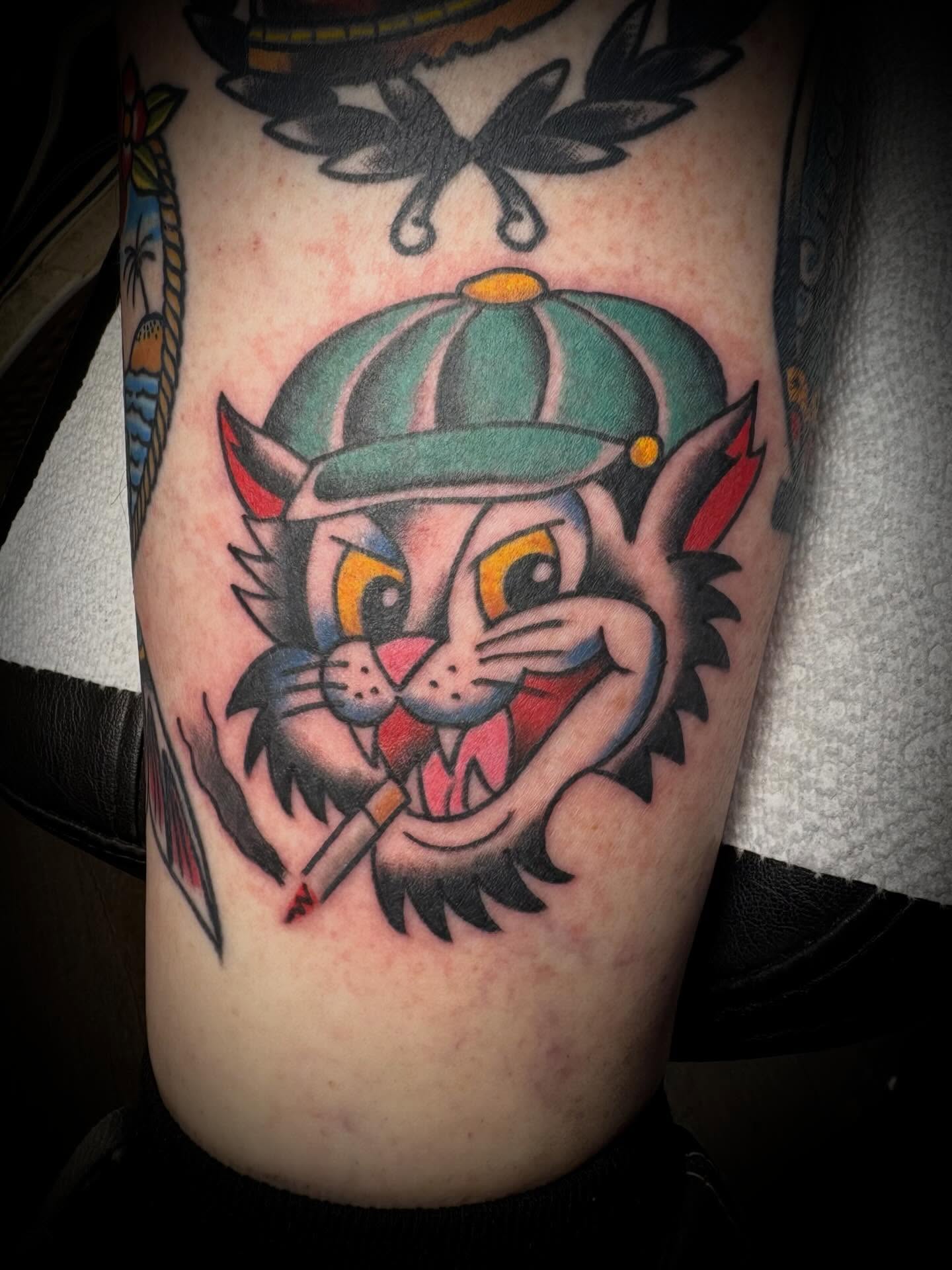 Cat wearing cap American traditional tattoo on the forearm by Gardner, Gardner, Massachusetts