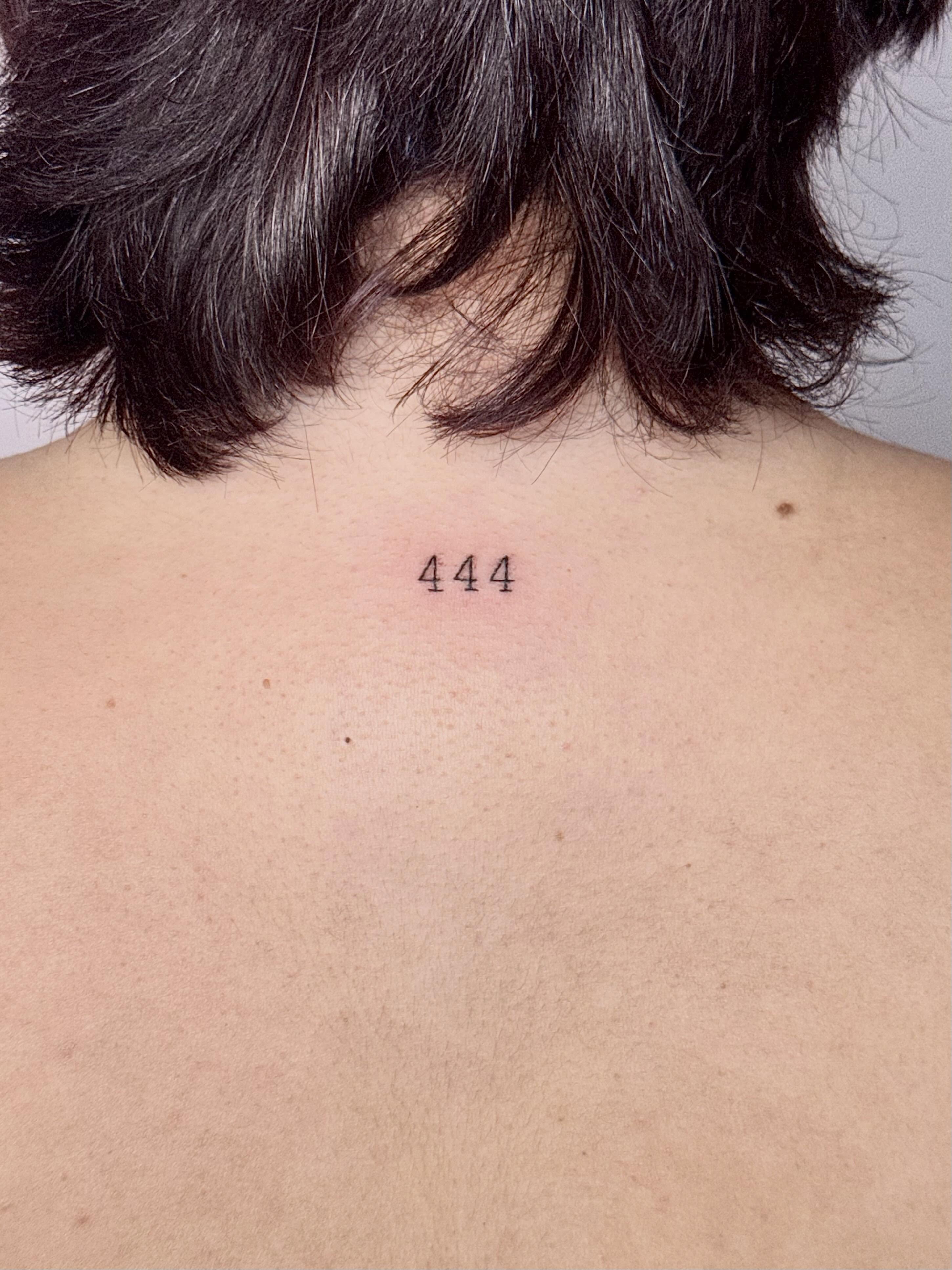 Number minimalist tattoo on the back by Sierra Seton