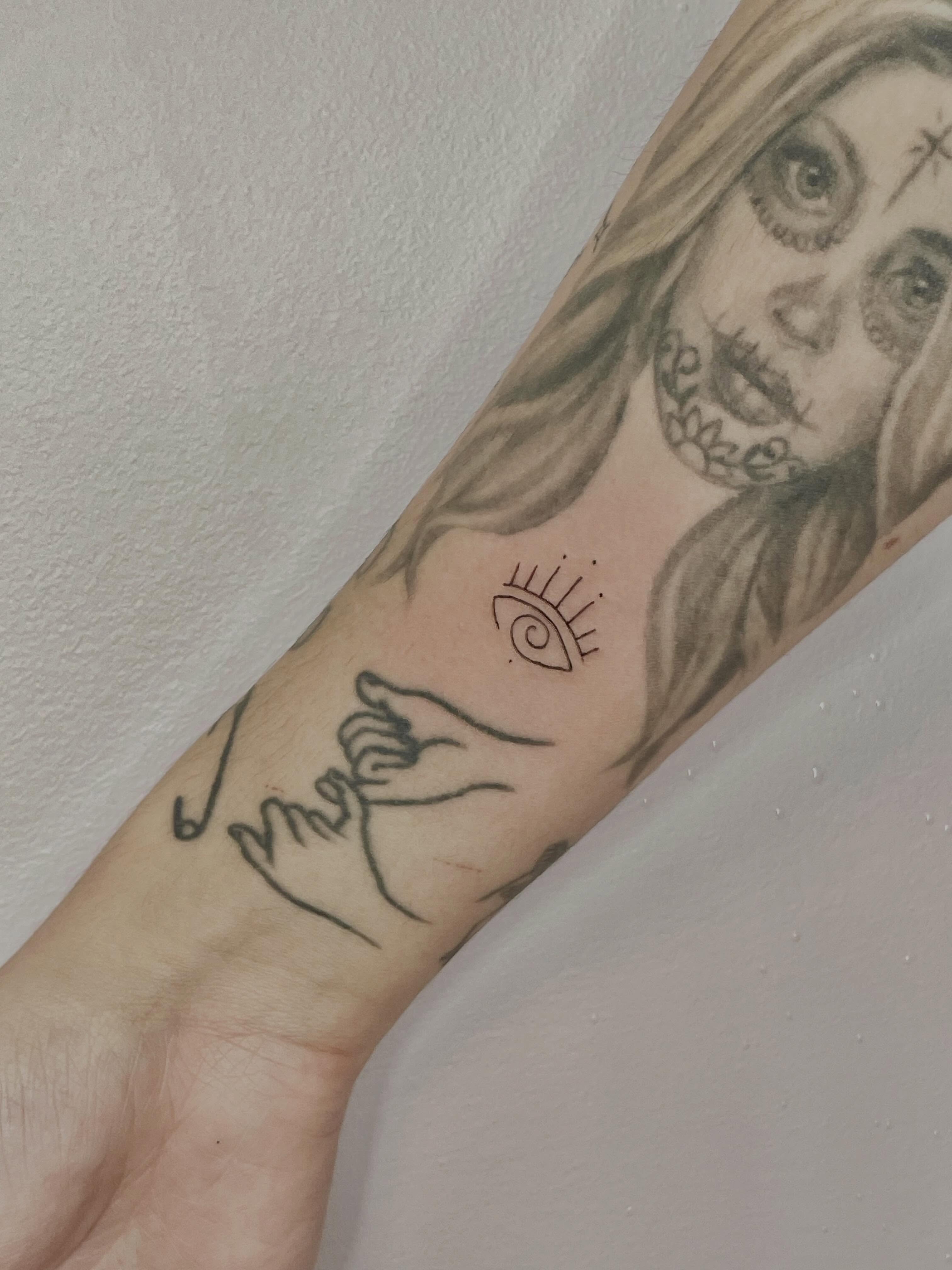 Woman with skull realism tattoo on the forearm by Sierra Seton