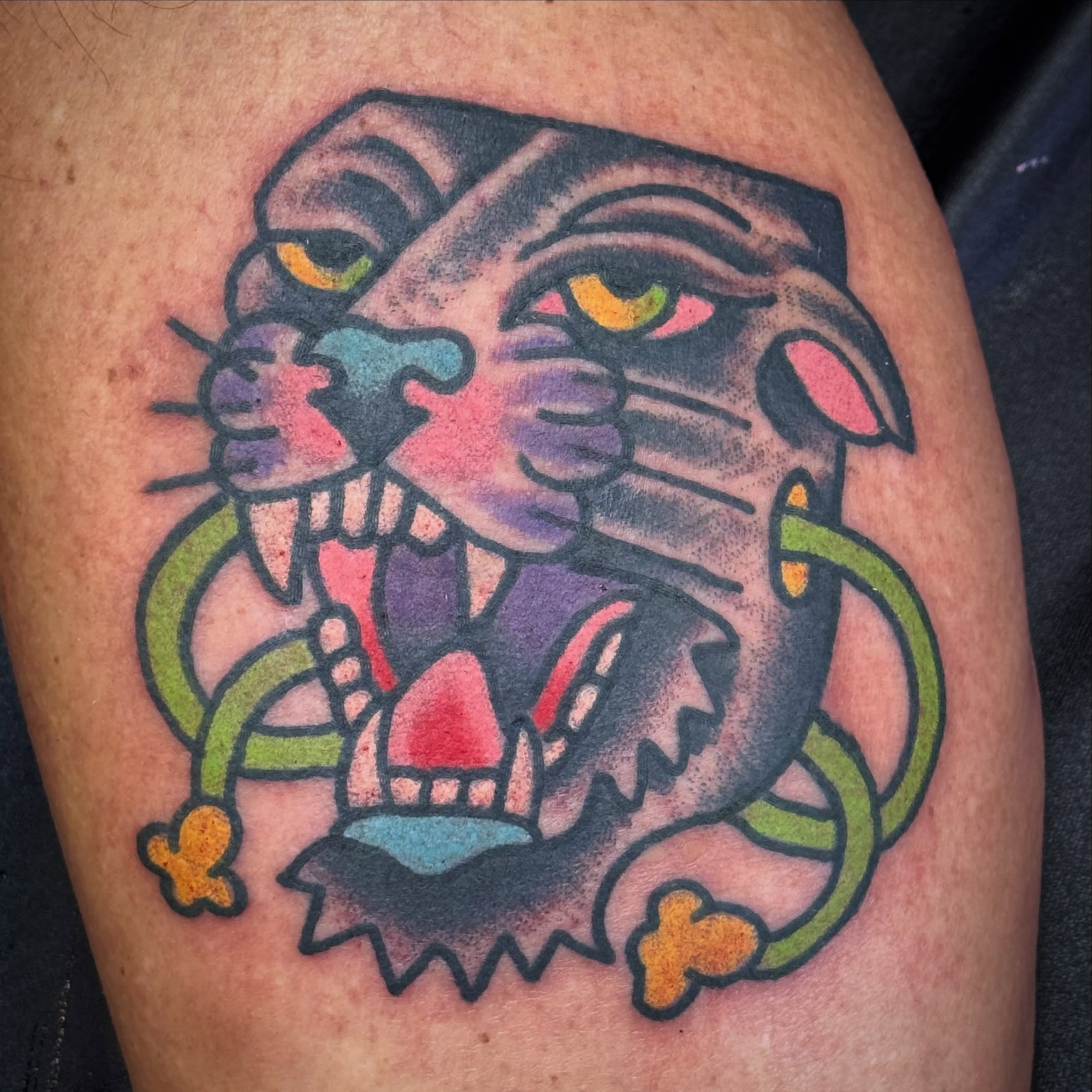 Tiger head American traditional tattoo on the thigh by Sam Hambrick, Watchung NJ