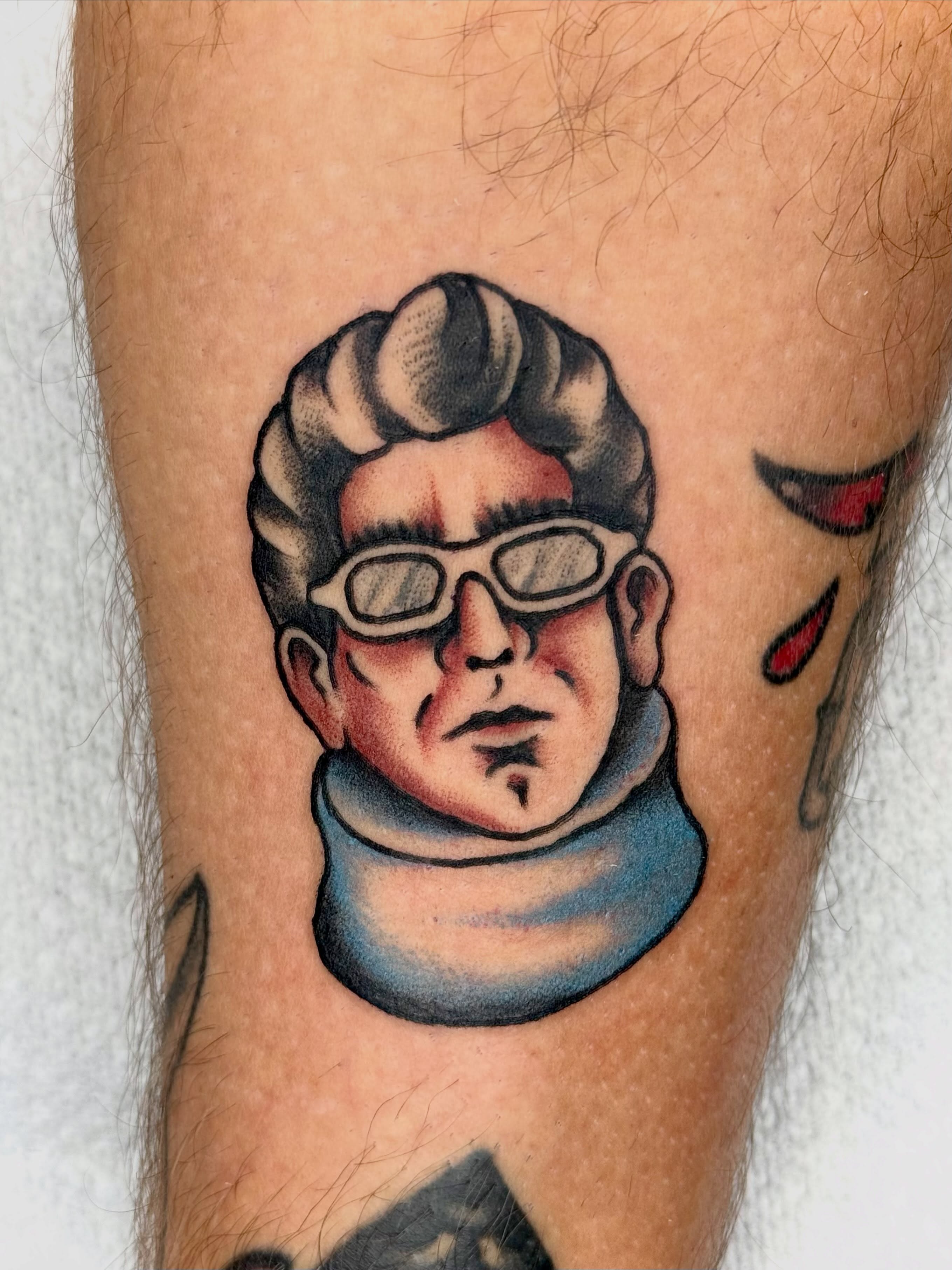 Man wearing goggles American traditional tattoo on the forearm by Ty Elias
