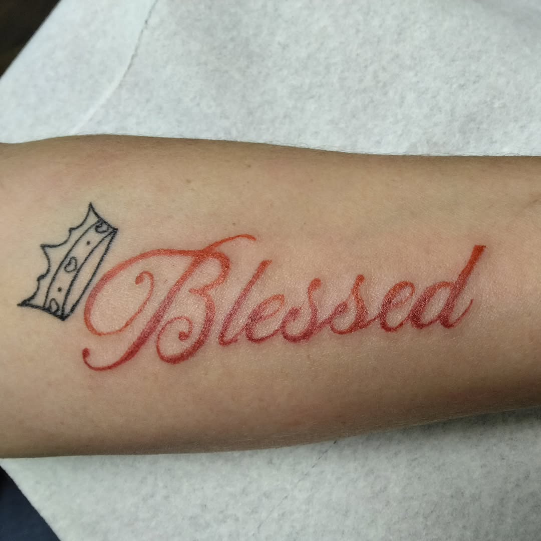 Blessed lettering script tattoo on the forearm by Malynda