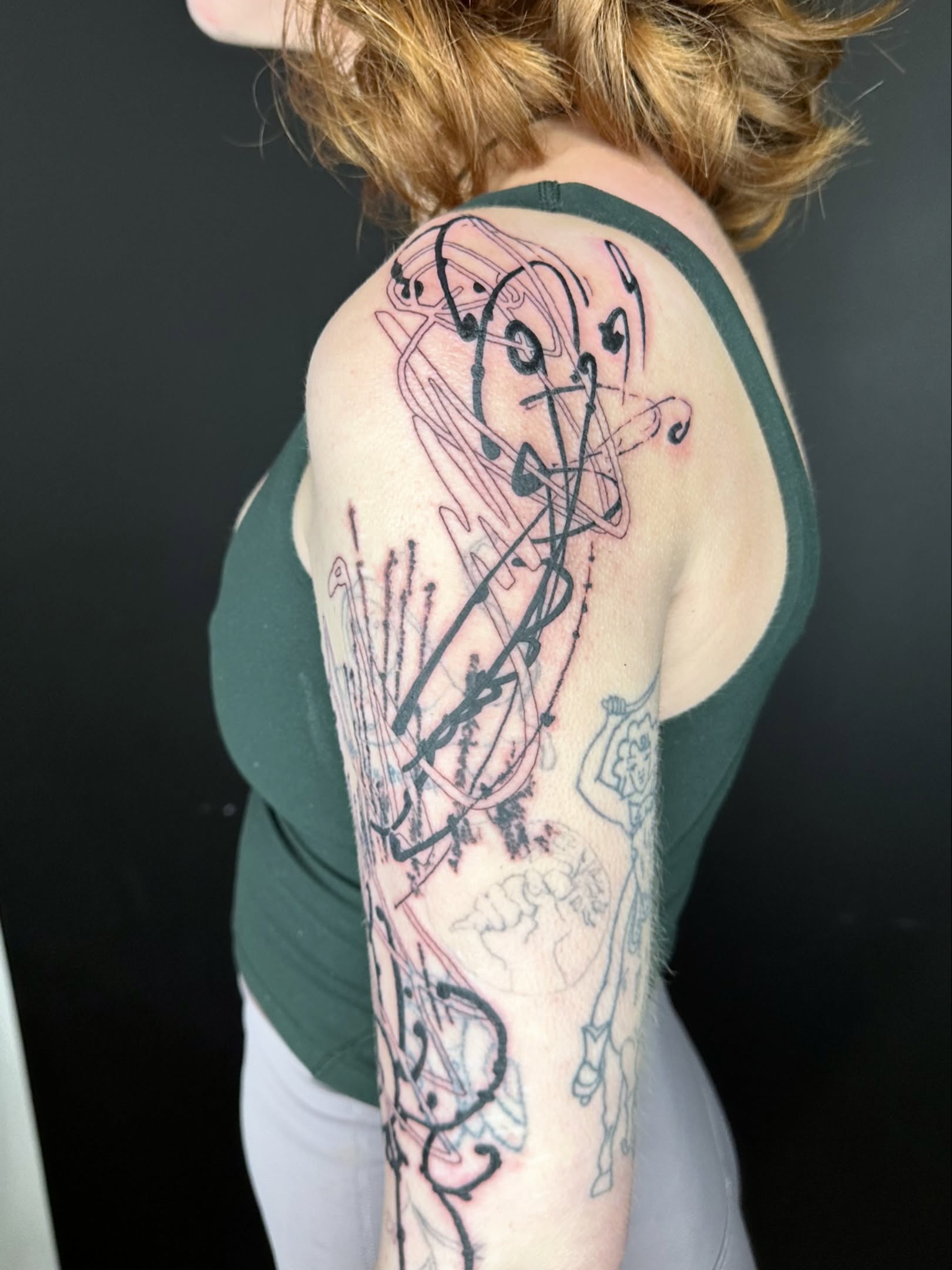 Abstract design geometric tattoo on the upper arm by reid - tattoo artist