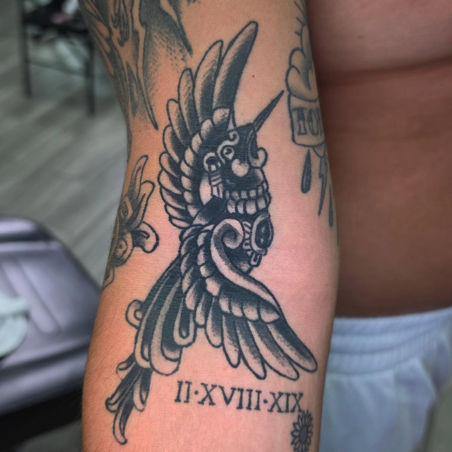 Bird-like creature American traditional tattoo on the forearm by Oliver Ⴟ Graves