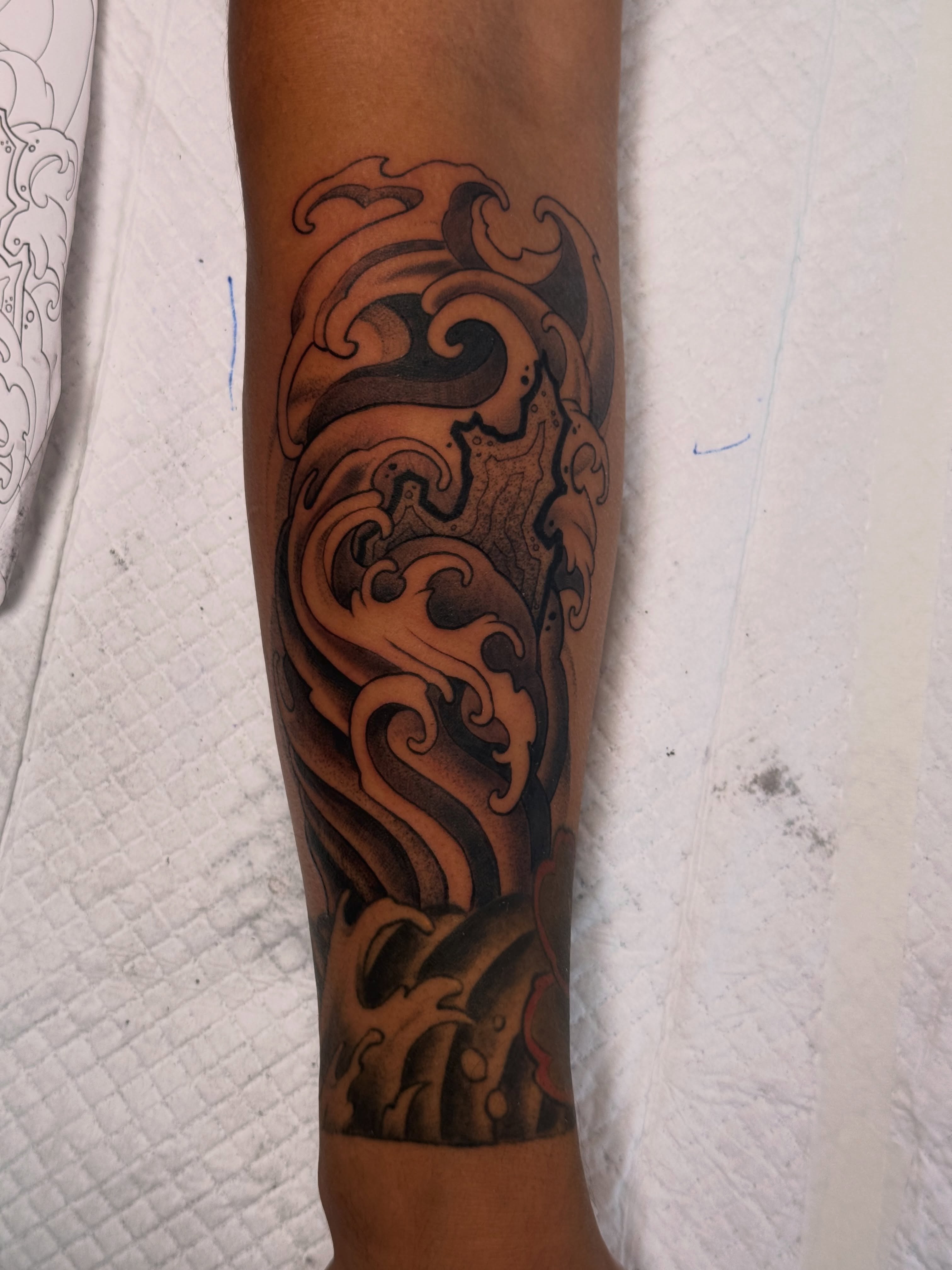 Waves black and grey tattoo on the forearm by Derek Foferek, Charlotte, North Carolina