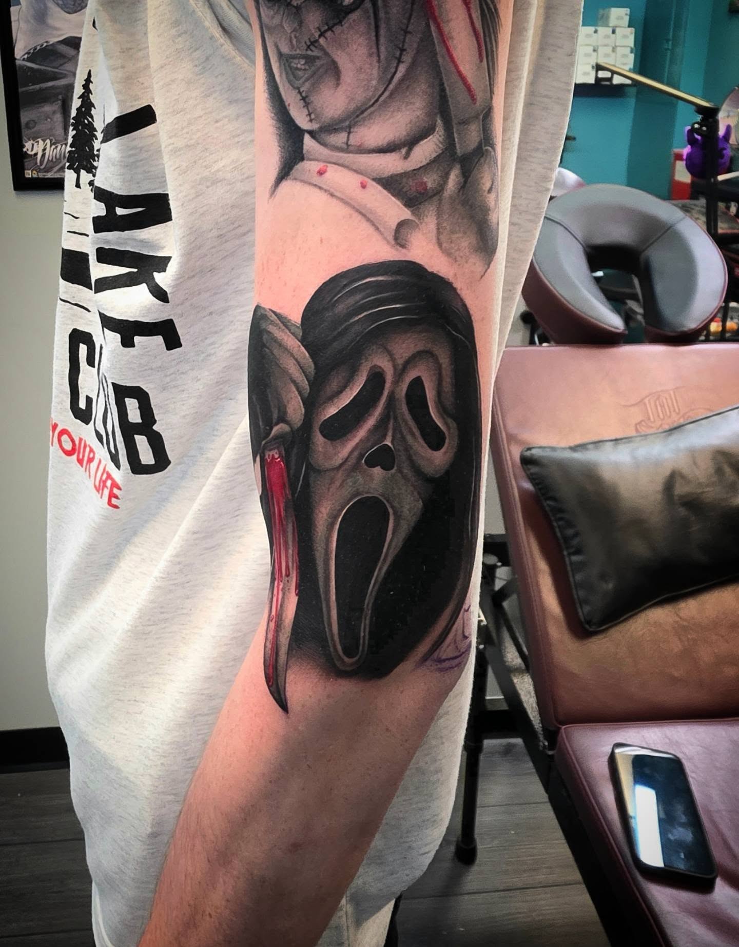 Scream mask realism tattoo on the forearm by Danielle Elizabeth