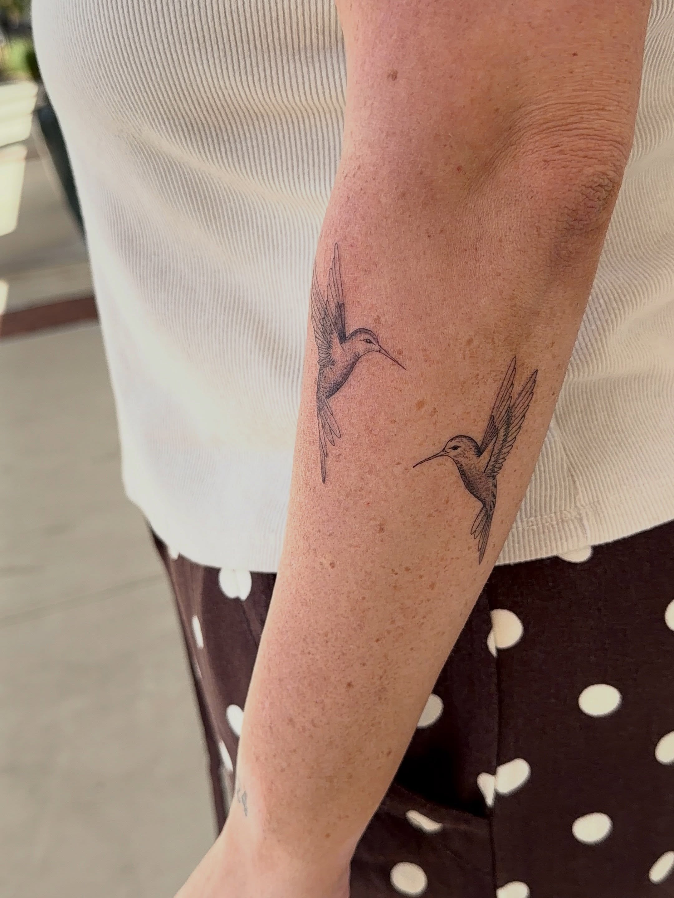 Hummingbirds black and grey tattoo on the forearm by Jacksyn, Plano, Texas