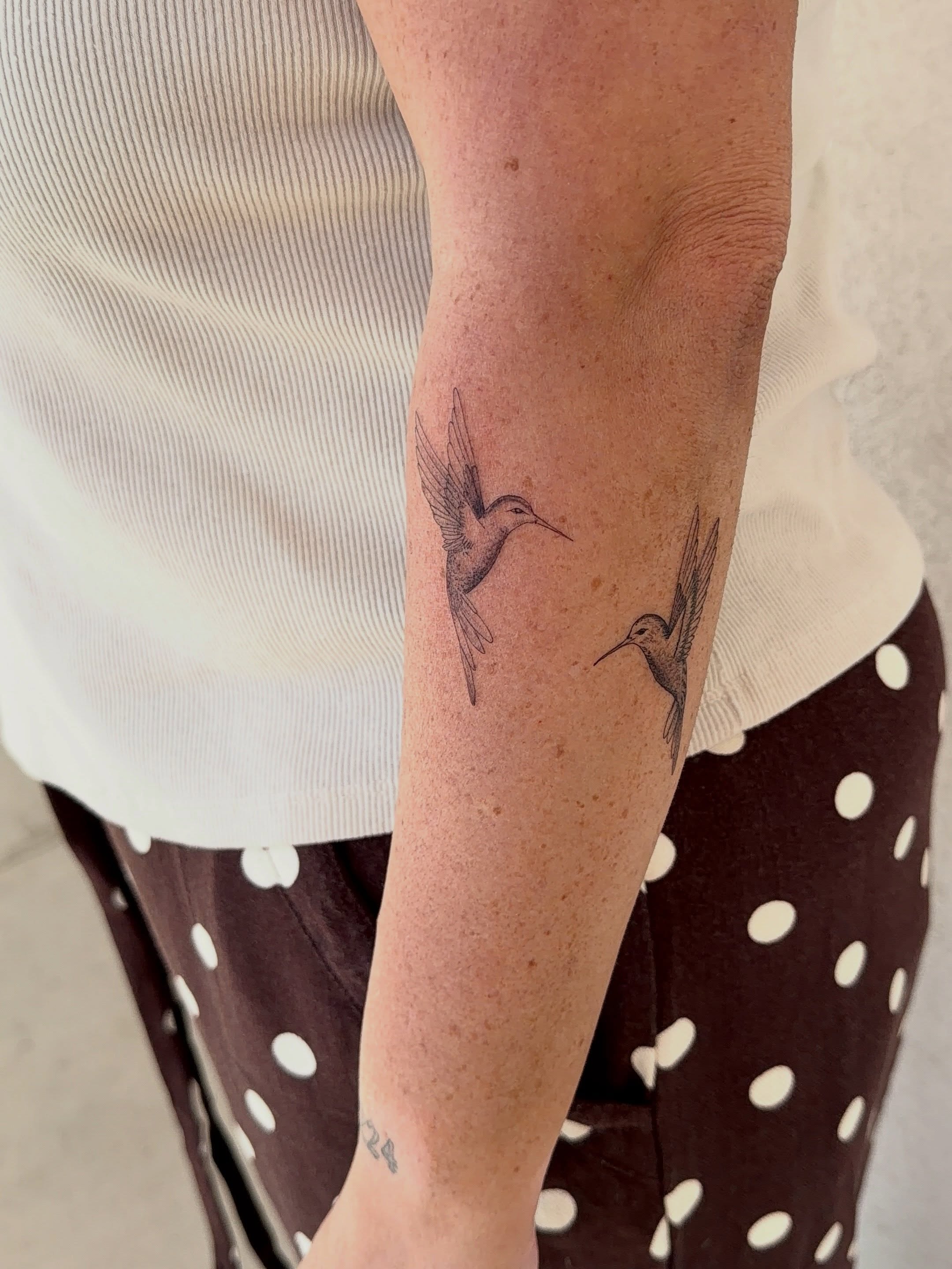 Hummingbirds black and grey tattoo on the forearm by Jacksyn, Plano, Texas