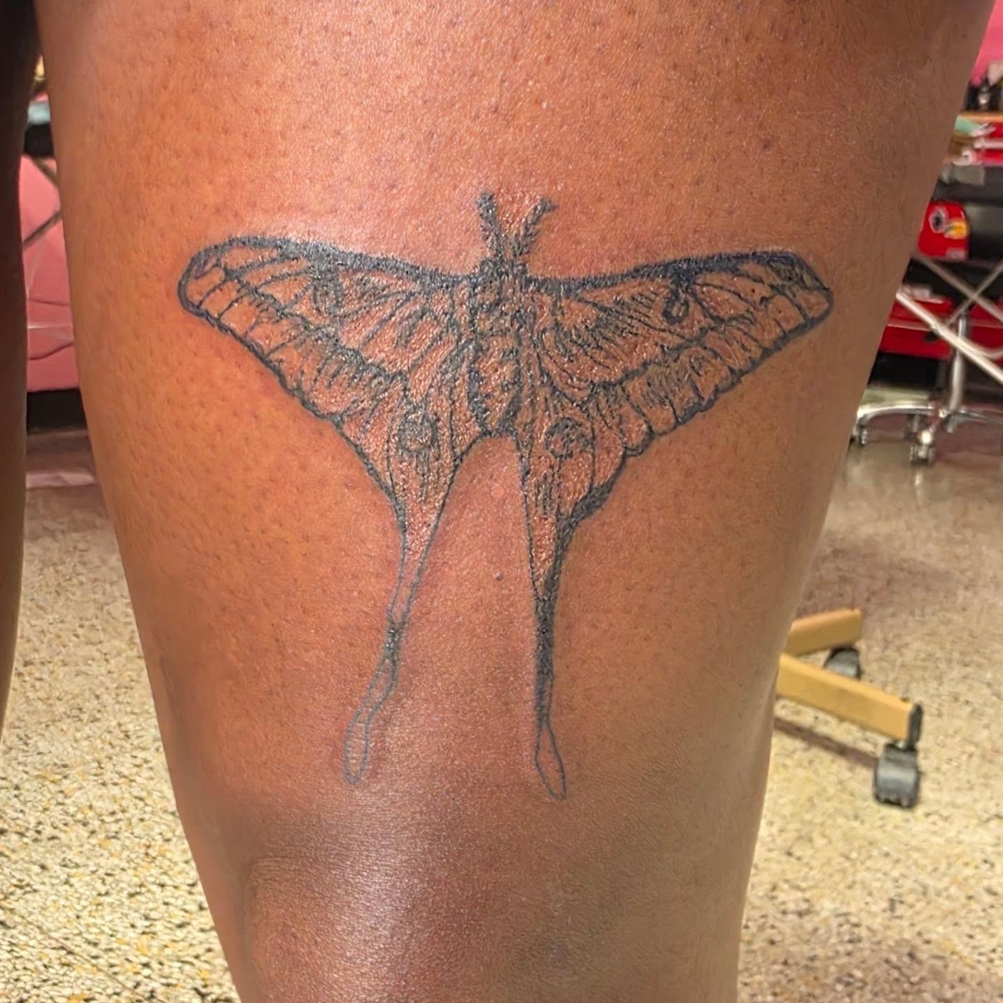 Moth black and grey tattoo on the thigh by K.F. Golden