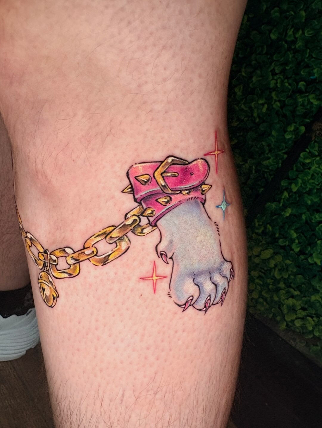 Dog paw in collar new school tattoo on the forearm by jo, Wichita, Kansas