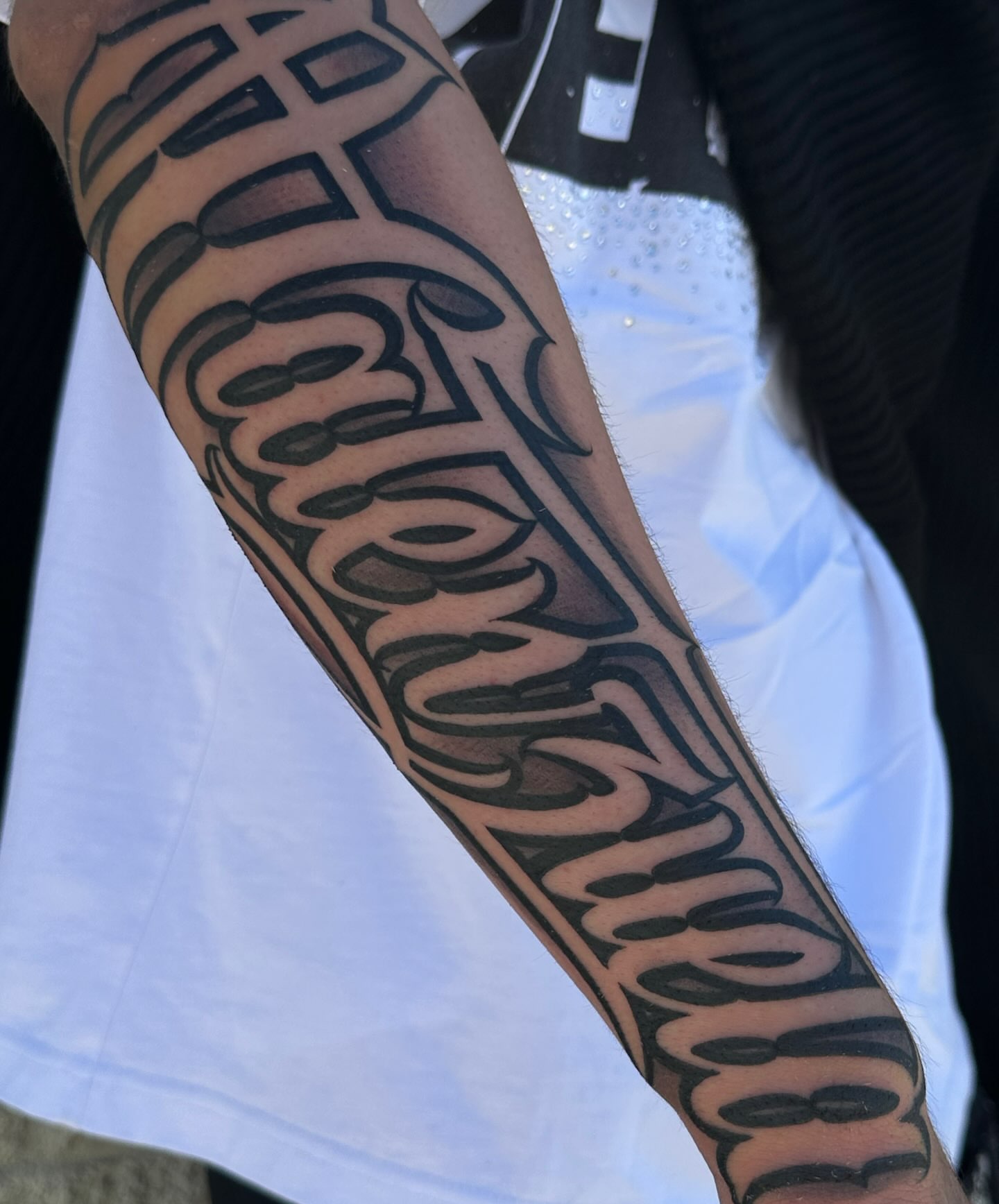 Script lettering lettering script tattoo on the forearm by San Diego Tattoo Artist
