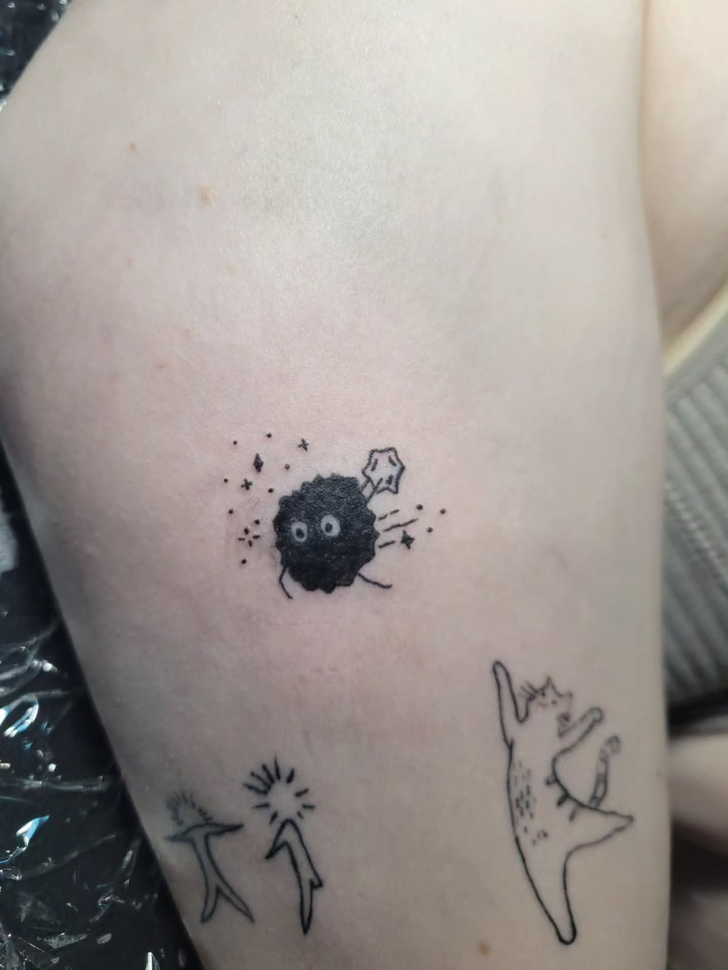 Space-themed creature dotwork tattoo on the thigh by Bee