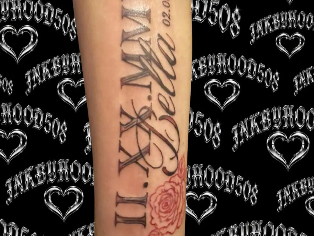 Roman numerals and name lettering script tattoo on the forearm by Hood