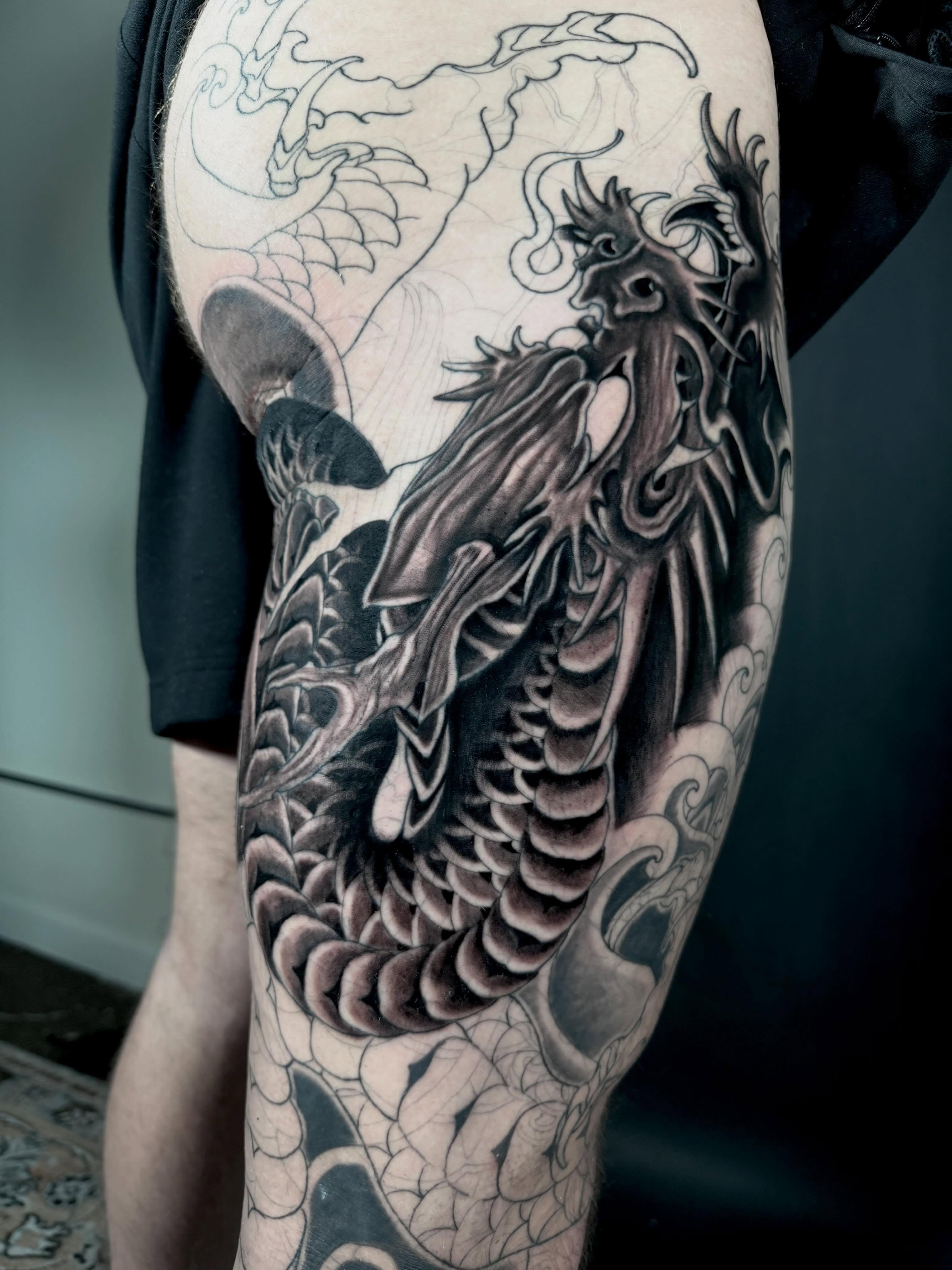 Dragon realism tattoo on the thigh by Daniel Gutierrez