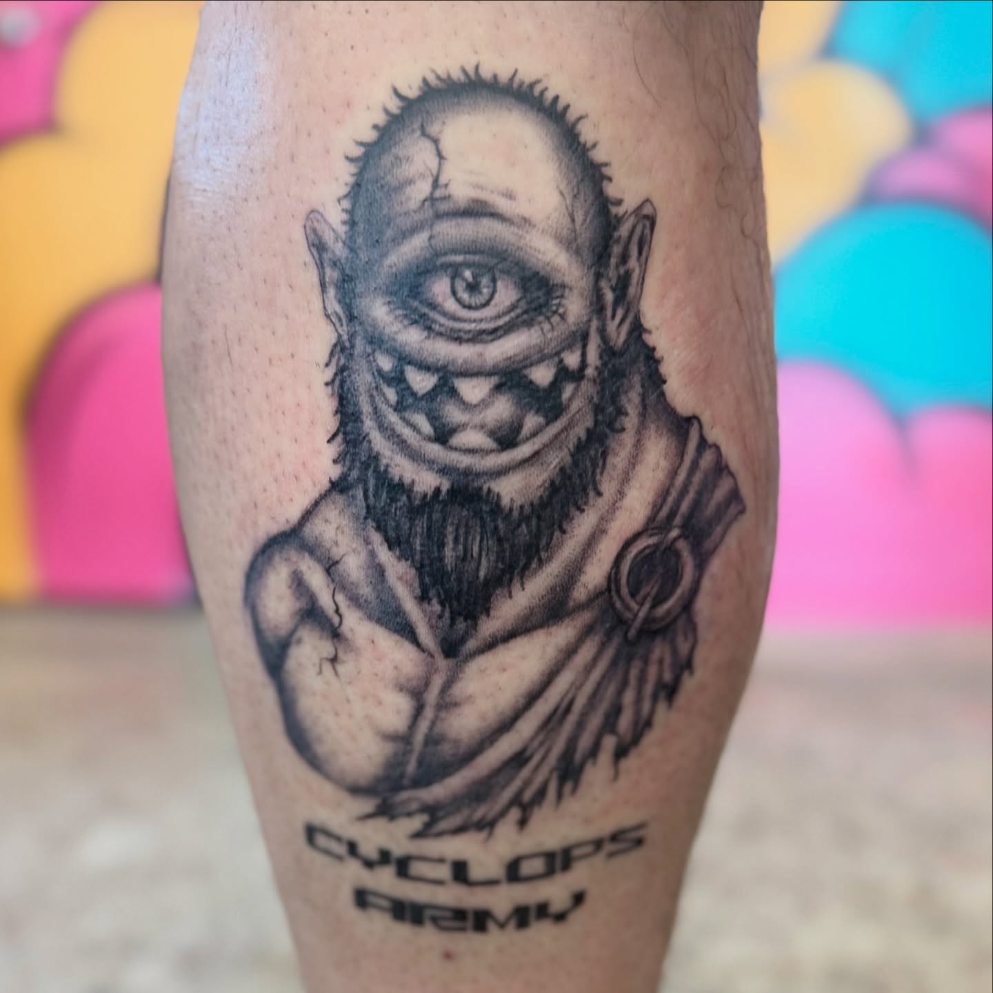 Cyclops black and grey tattoo on the forearm by Chuckthegirl